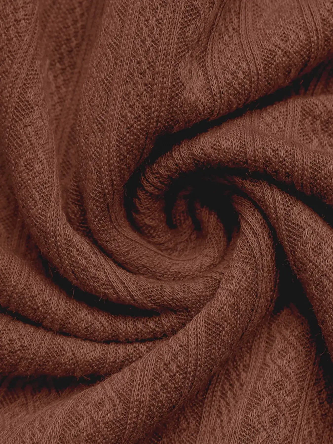 Ruffled Hem Long Sleeve Knit Dress fabric close-up showcasing cozy brown knit texture.