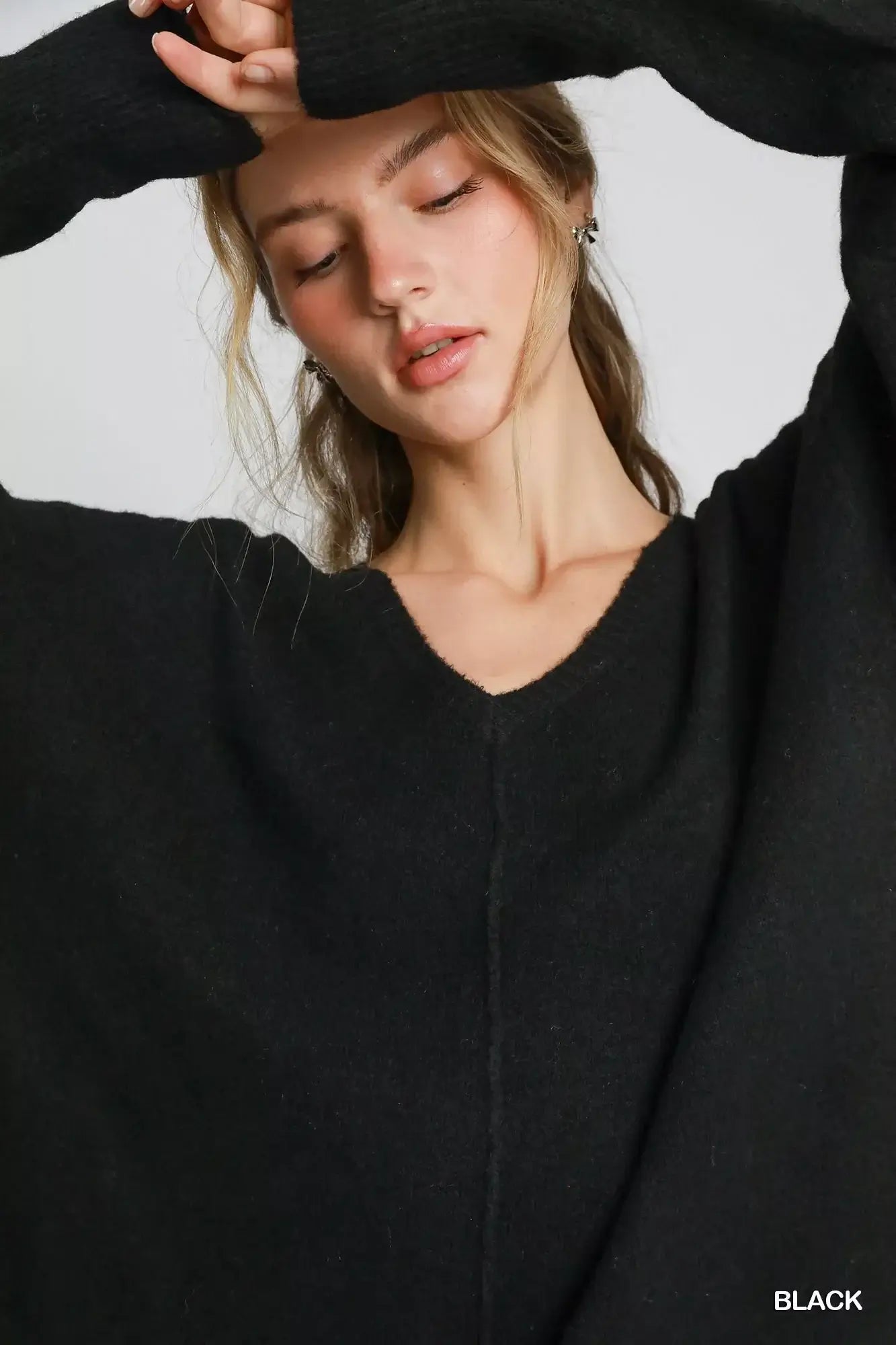 Umgee Wool Blended Pullover Sweater worn by model in black with V-neckline for chic winter comfort.