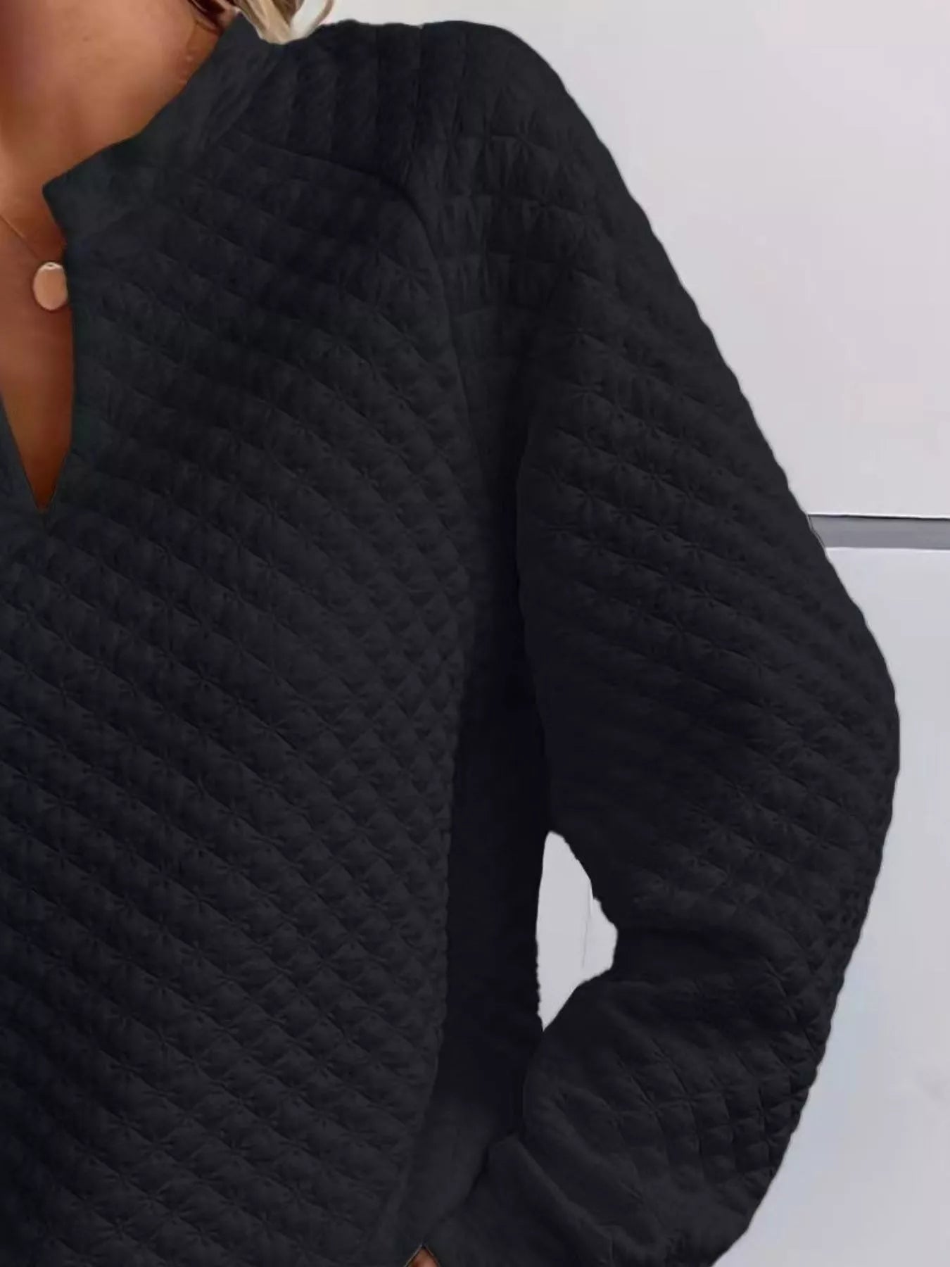 Quilted Texture Long Sleeve Sweatshirt with Notched Neck style, featuring a cozy black quilted design.