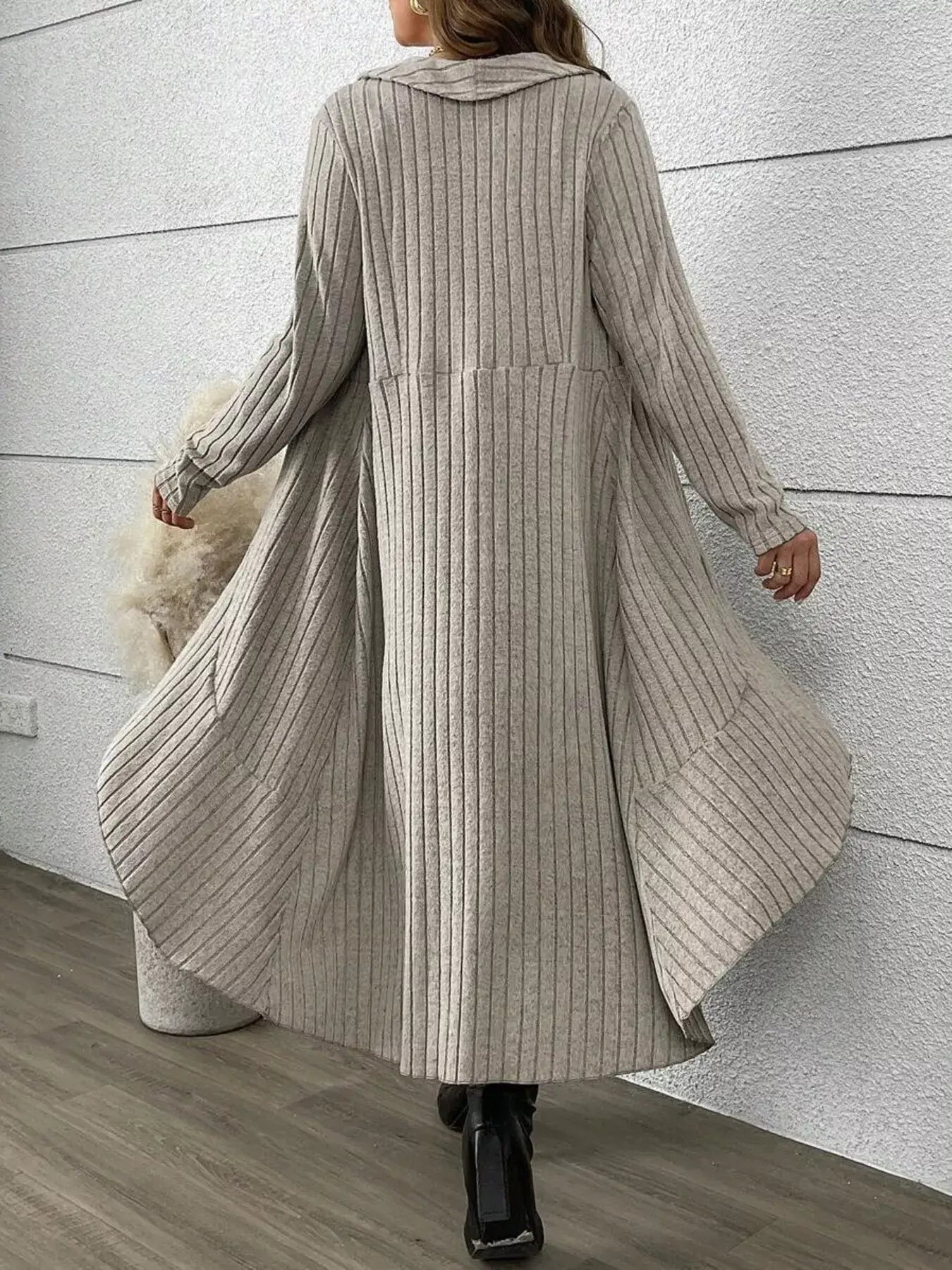 Back view of a woman wearing a Plaid Cami Dress and Ribbed Cardigan Set, showcasing its flowing design.