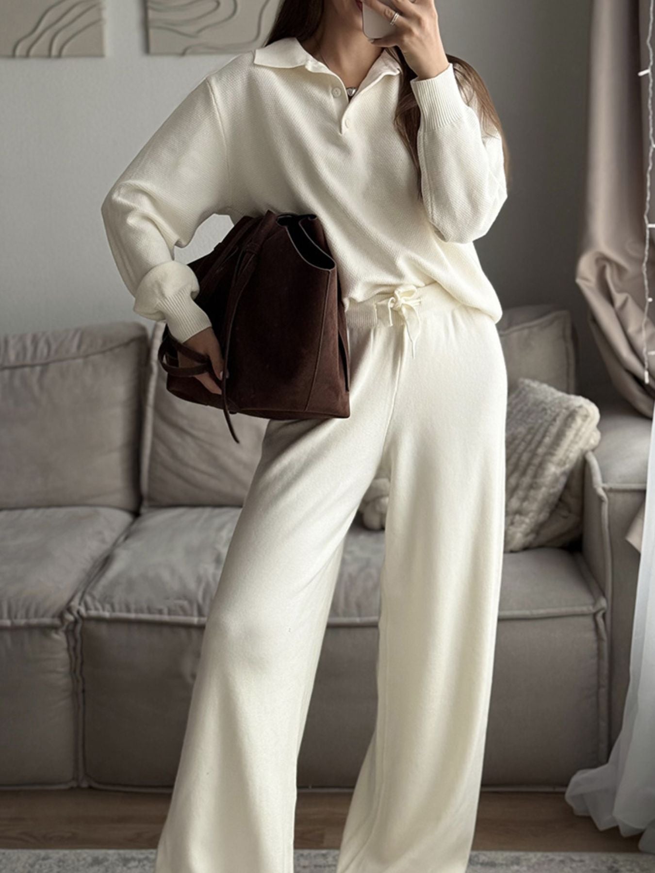 Polo Collar Knit Two Piece Set featuring a cozy top and pants in cream, paired with a stylish brown handbag.