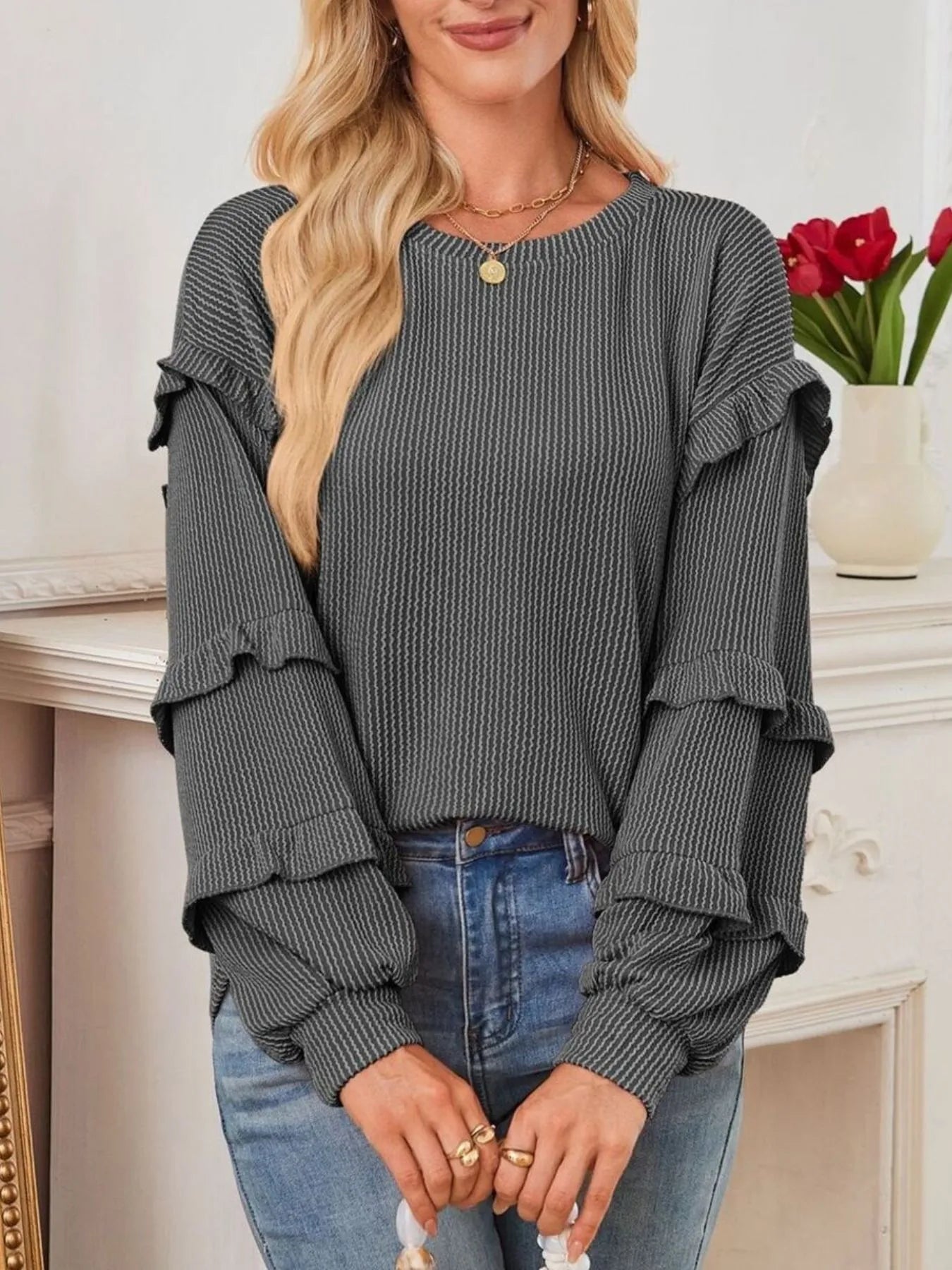 Ruffled Round Neck Long Sleeve Sweatshirt with ribbed fabric and ruffled sleeves, styled for everyday fashion.