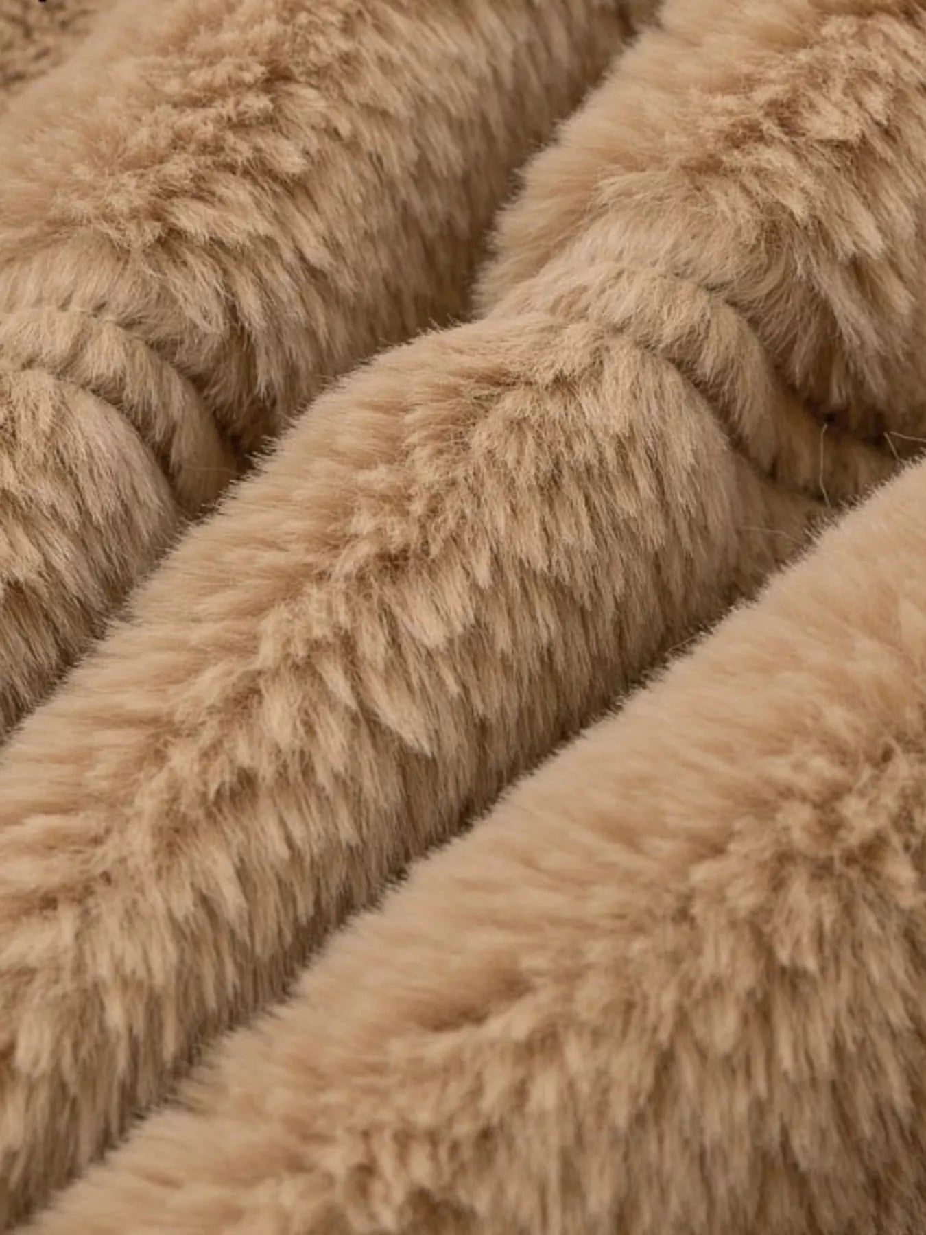 Faux Fur Cropped Zip-Up Jacket fabric close-up showing soft and cozy texture, ideal for cold-season style.