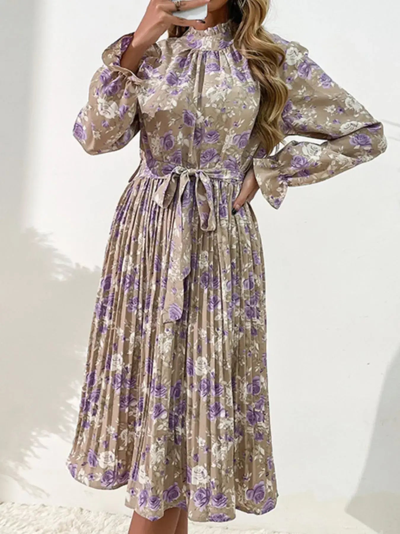 Floral Print Long Sleeve Pleated Midi Dress showcased with elegant floral pattern and flattering pleated design.