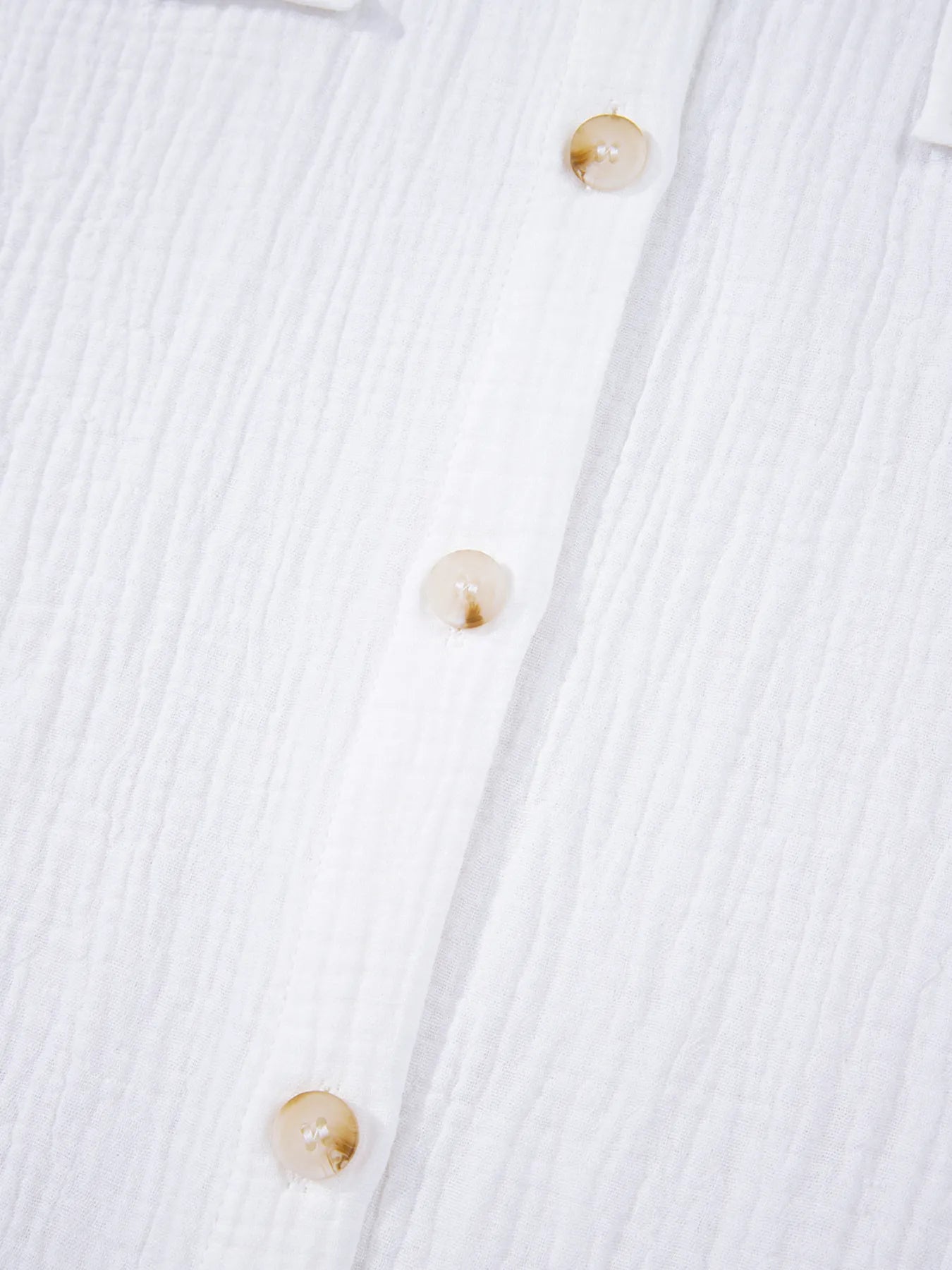 Close-up of Lace Sleeve Button Down Shirt featuring textured fabric and decorative buttons.