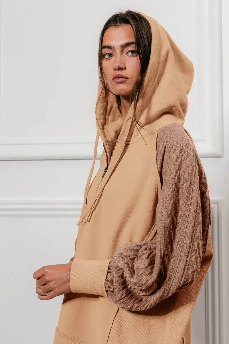 BiBi Half Zip French Terry Hoodie with Knit Sleeves worn by a model, showcasing its stylish and casual design.