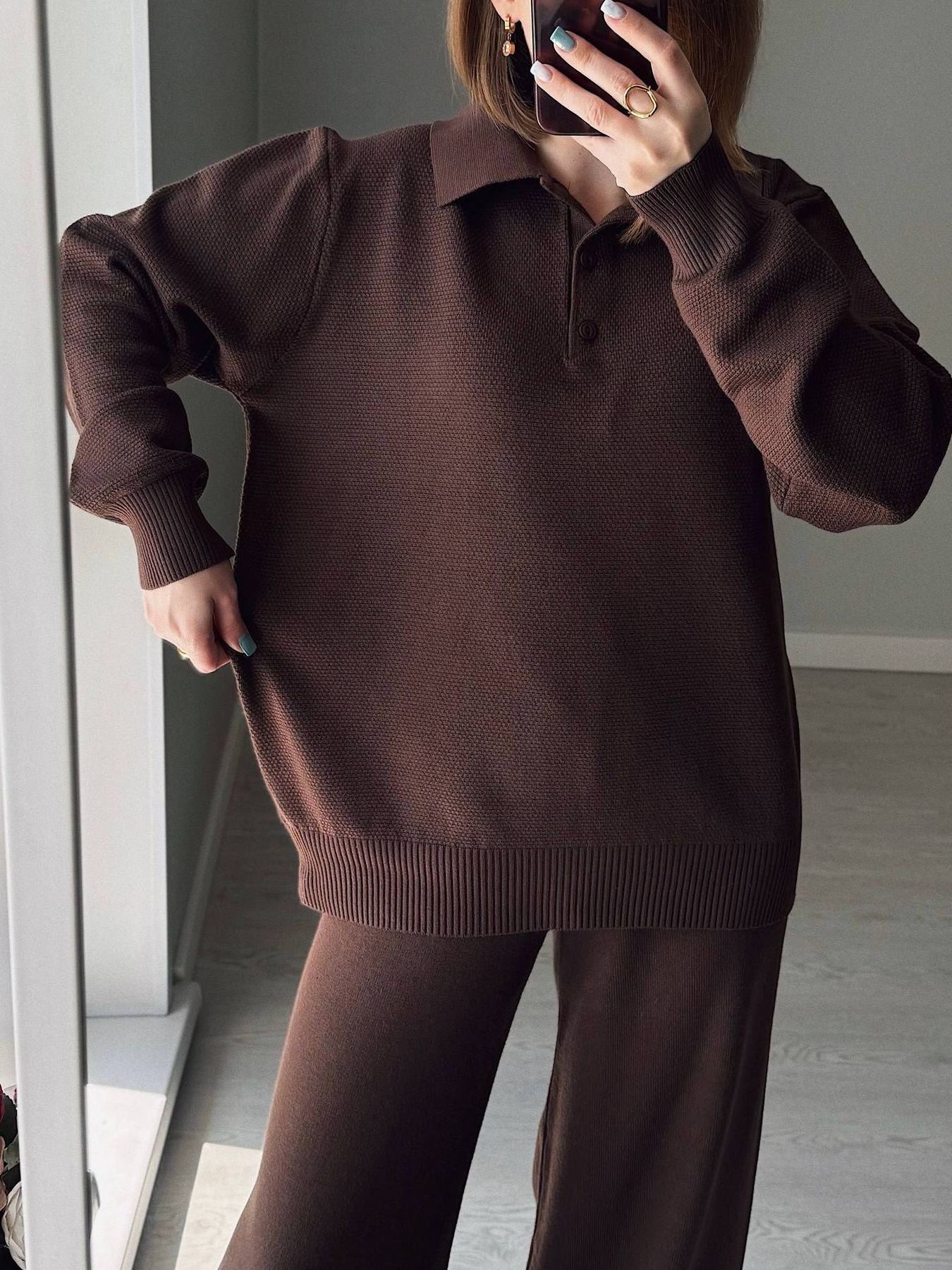 Polo Collar Knit Two Piece Set featuring a stylish brown top and matching pants, showcasing its cozy and slightly stretchy fabric.