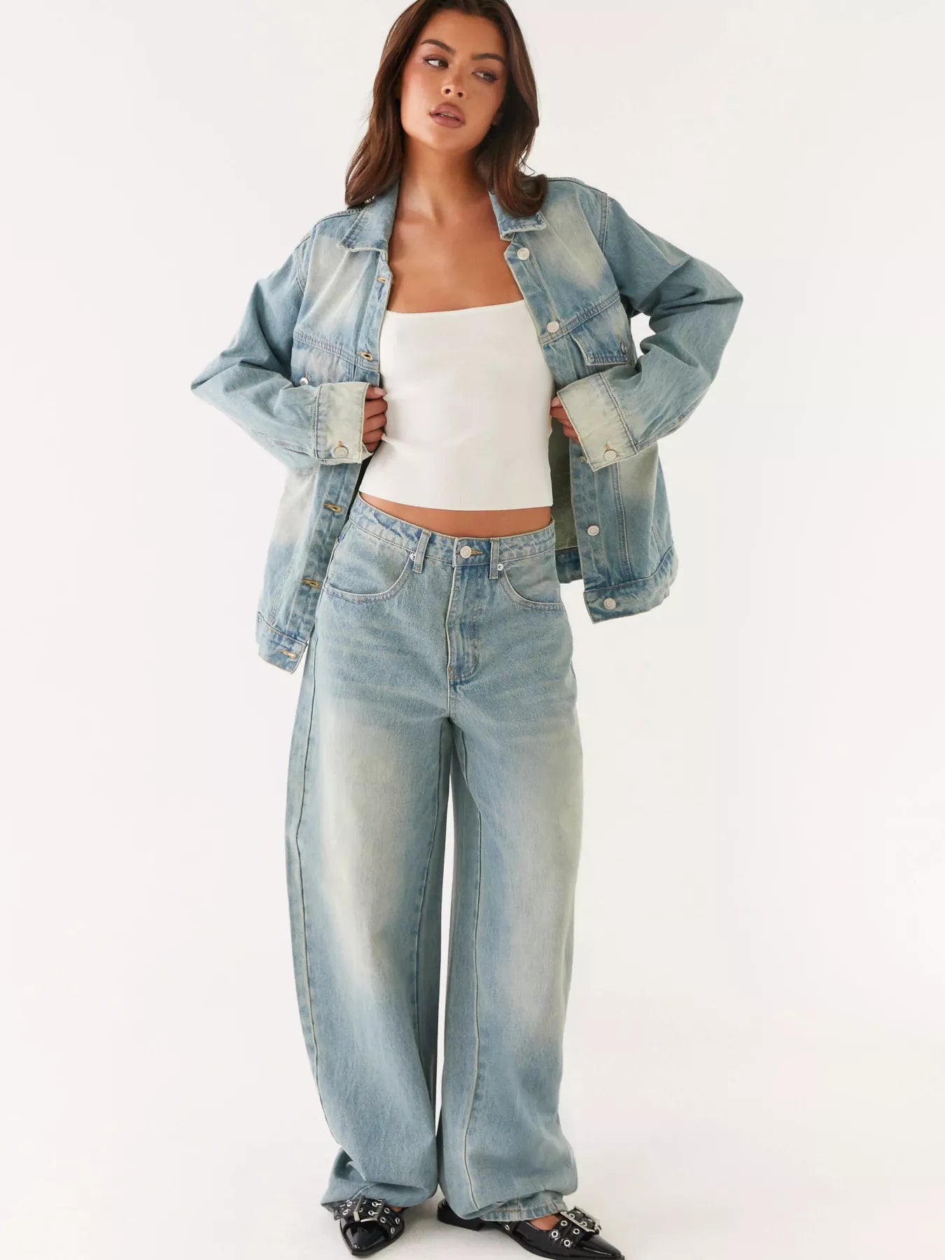 Model wearing Button Up Denim Jacket and Jeans Set, featuring a stylish denim jacket and loose-fitting jeans.