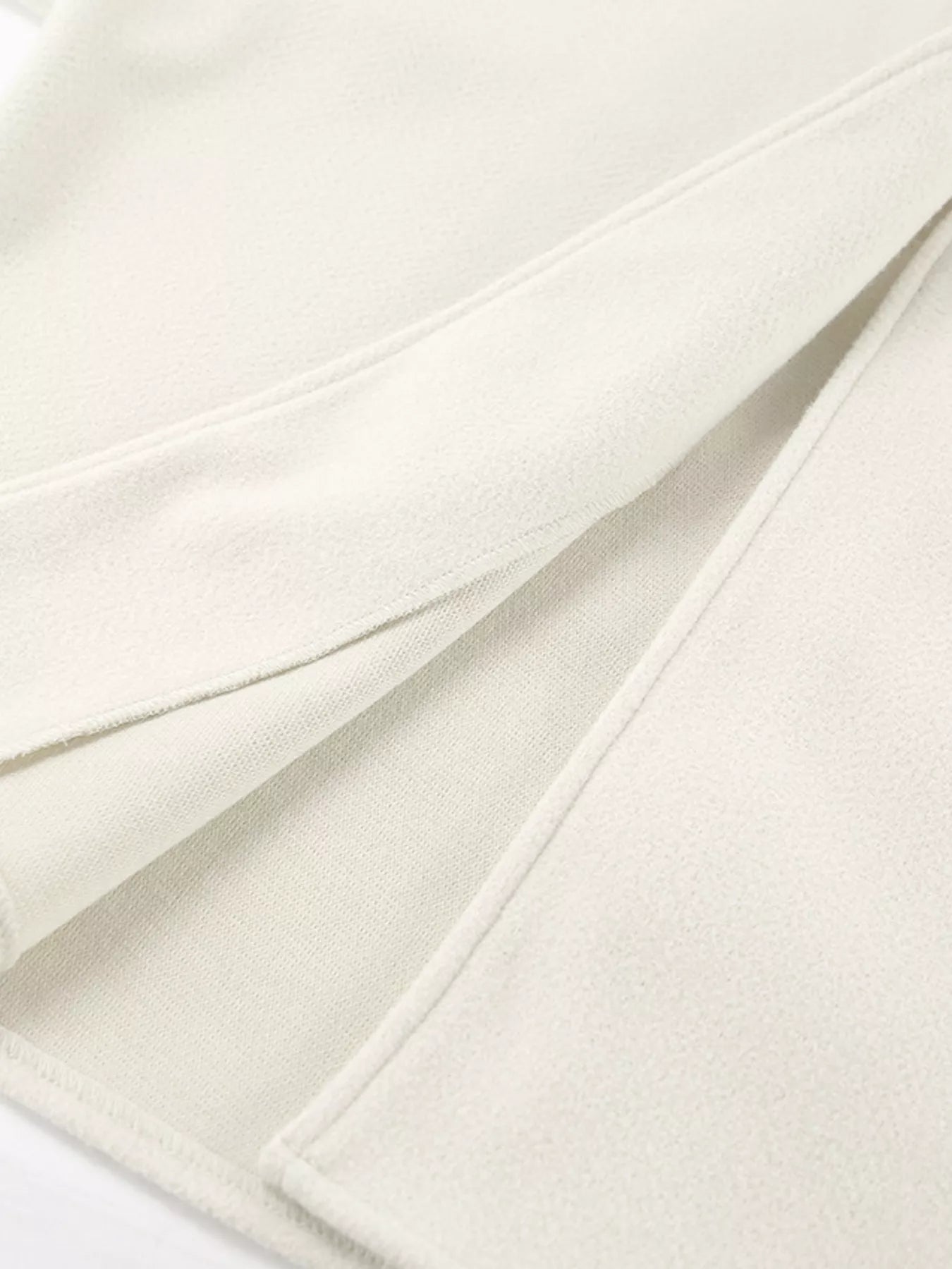 Open Front Dropped Shoulder Outerwear for Women in soft cream fabric, showcasing its smooth texture and stylish design.