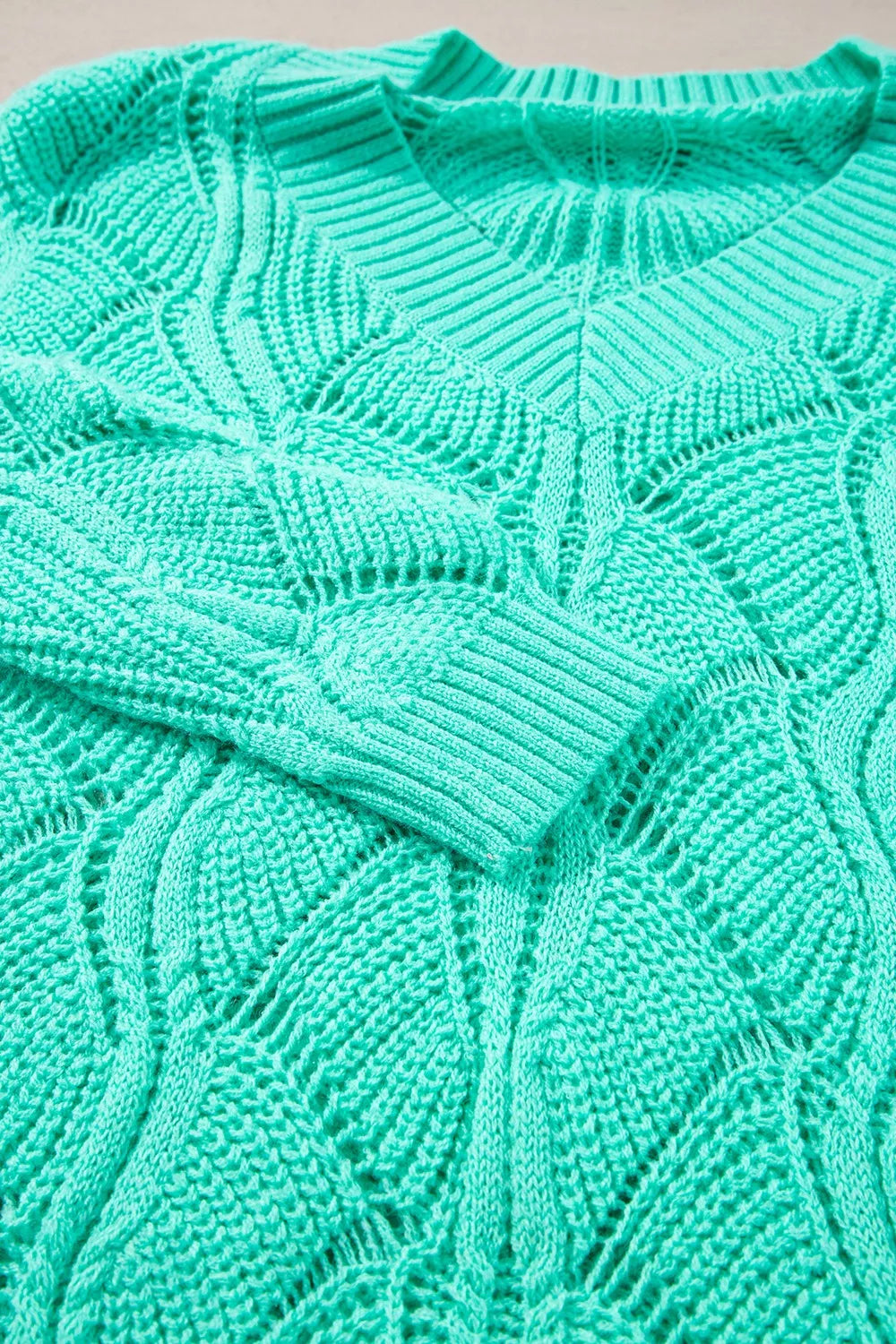 Elegant Texture V-Neck Knit Top featuring a mint green cable knit design and openwork knit pattern.