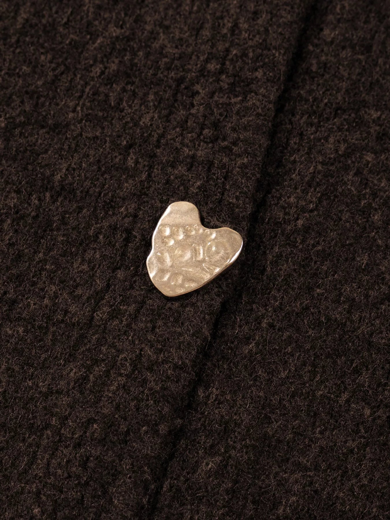 Close-up of the heart metal button on the Heart Metal Button V Neck Cardigan Sweater for women.