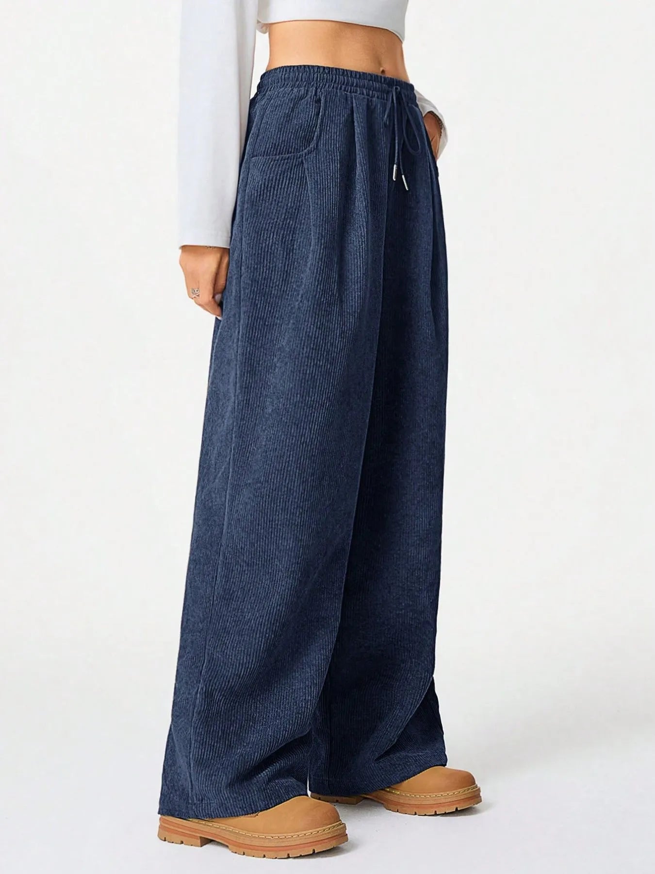 Drawstring Wide Leg Pants featuring a relaxed fit with pockets and a drawstring waistband for everyday comfort.