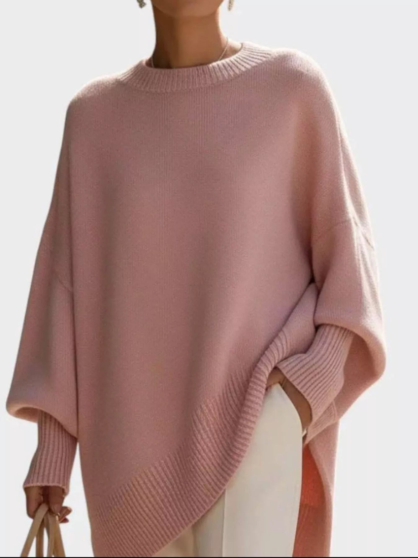 Oversized Batwing Sleeve Knit Sweater for Women in soft pink with a ribbed design and slightly oversized fit.