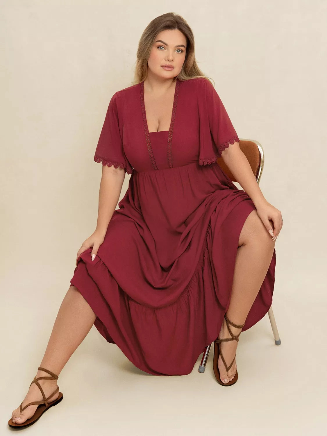 Plus Size Lace Detail Flutter Sleeve Maxi Dress in burgundy, featuring lace details and flutter sleeves.