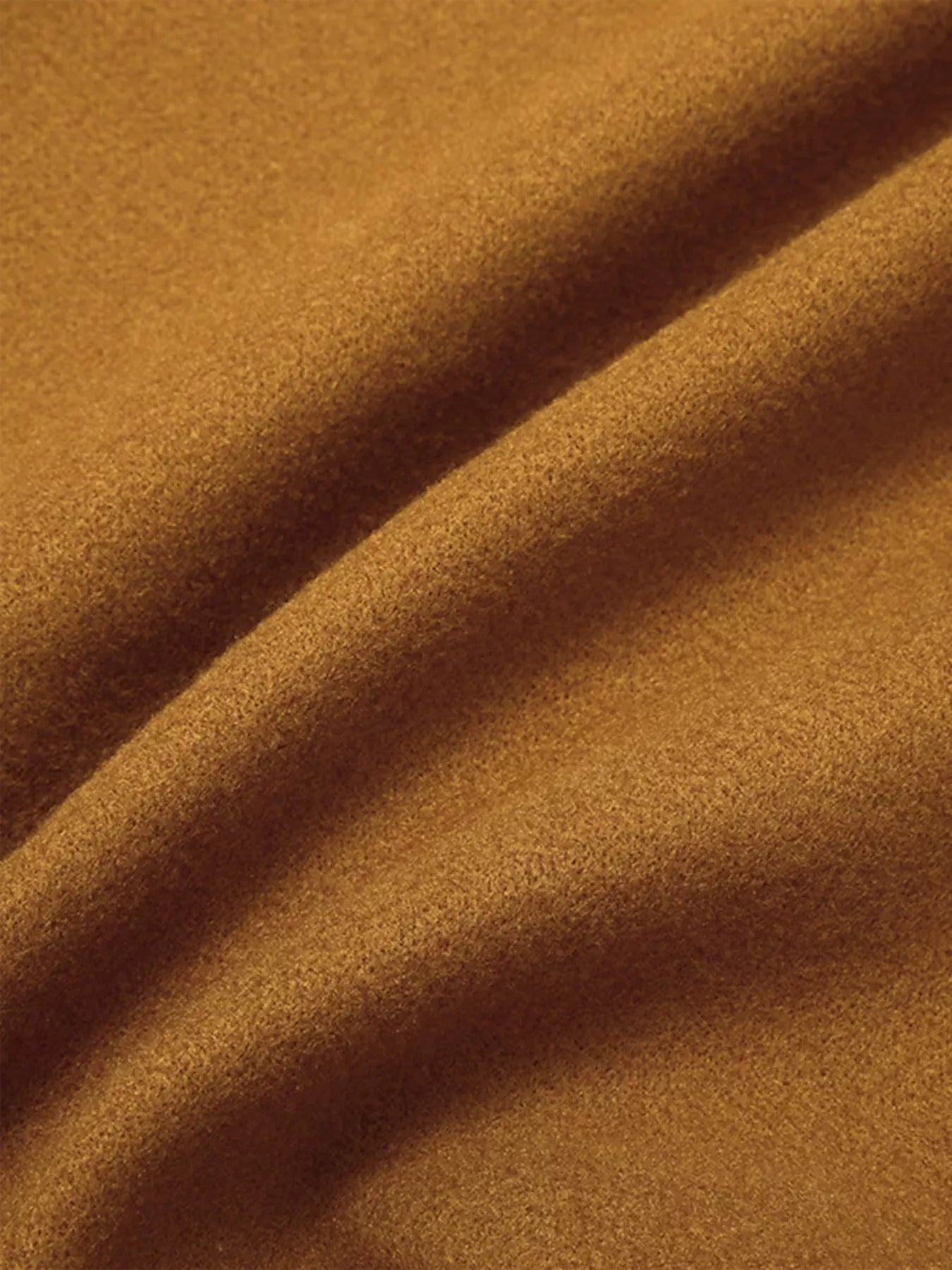 Close-up of a soft, warm fabric in rich golden brown color, perfect for making a Full Size Single Breasted Long Sleeve Overcoat.