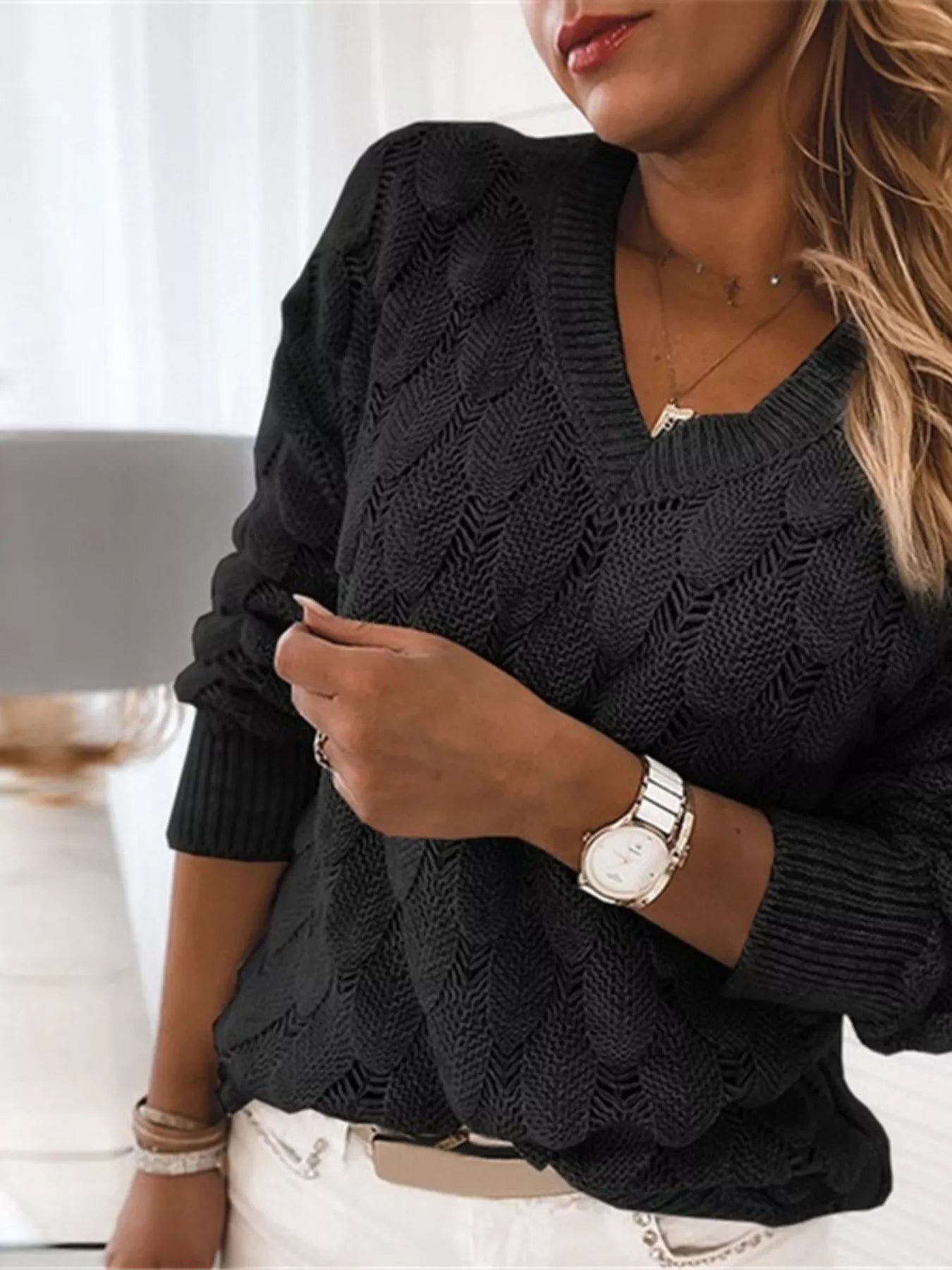 Stylish V-Neck Knitted Sweater in black featuring openwork knit design for effortless everyday style.