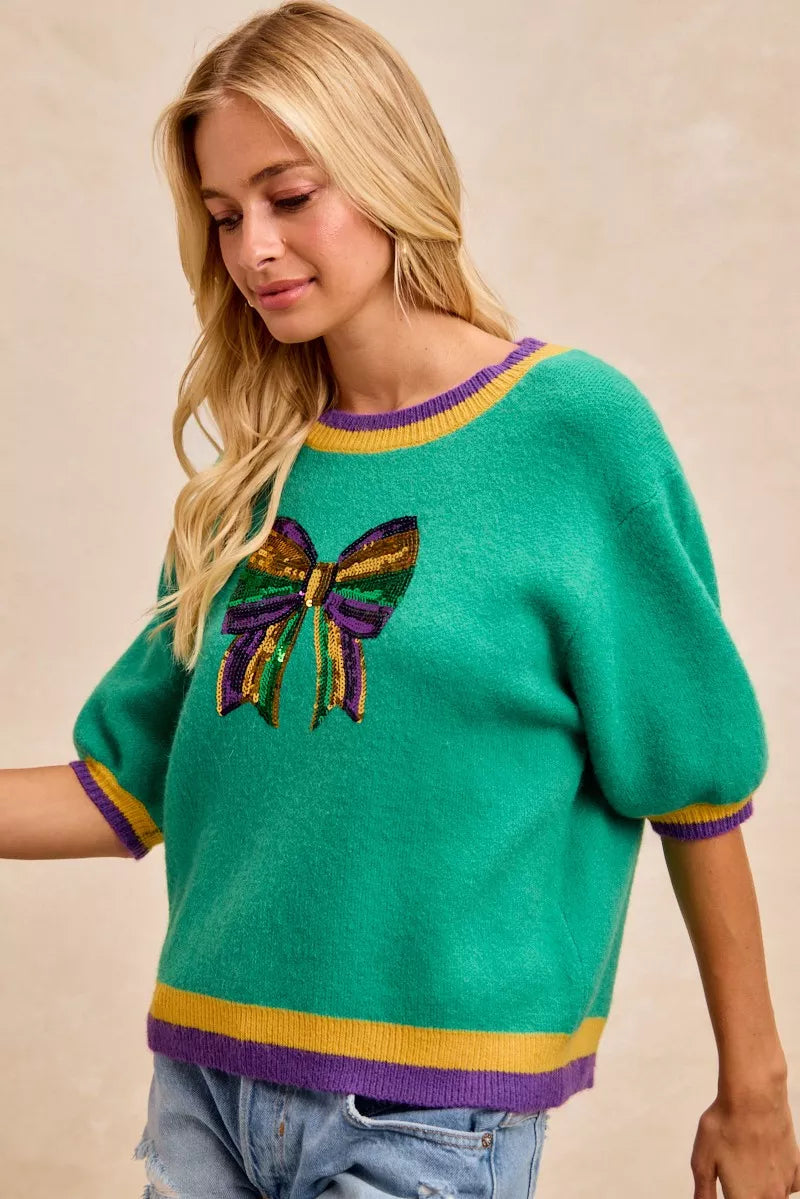 BiBi Mardi Gras Sequin Ribbon Patched Sweater featuring vibrant colors and sequin details in a stylish design.
