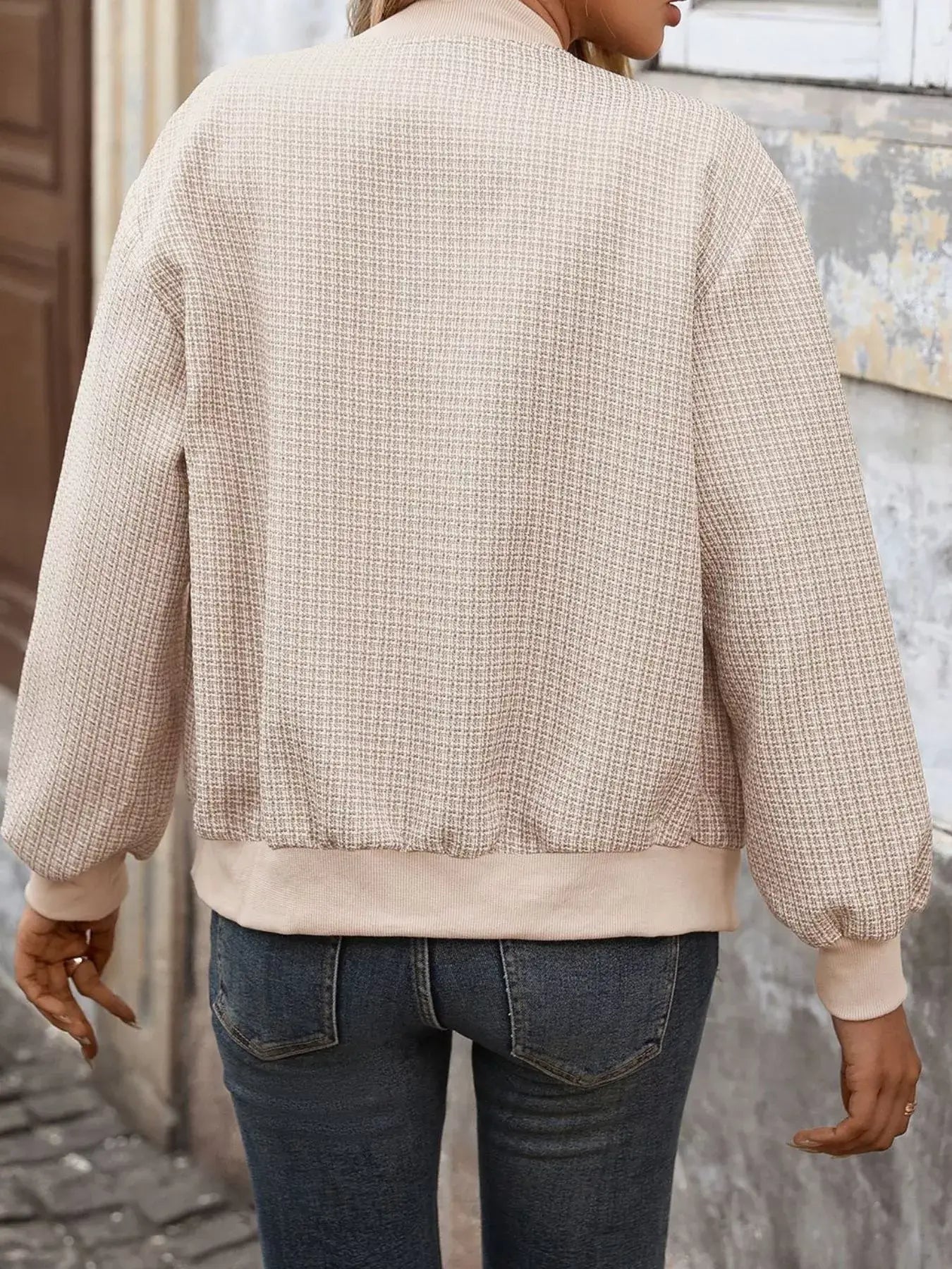 Back view of Button Up Long Sleeve Jacket with Pockets for Women, featuring a textured fabric and comfortable fit.