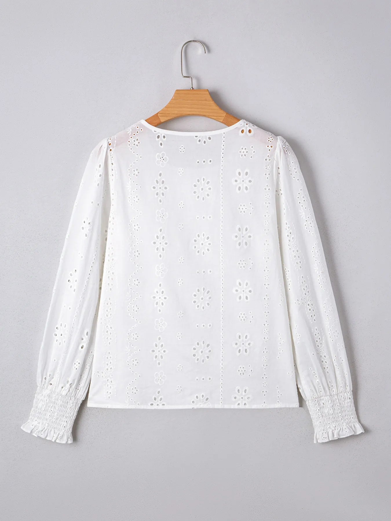 Eyelet Long Sleeve Blouse with Elastic Cuffs for Women, featuring delicate eyelet design and elastic cuffs.