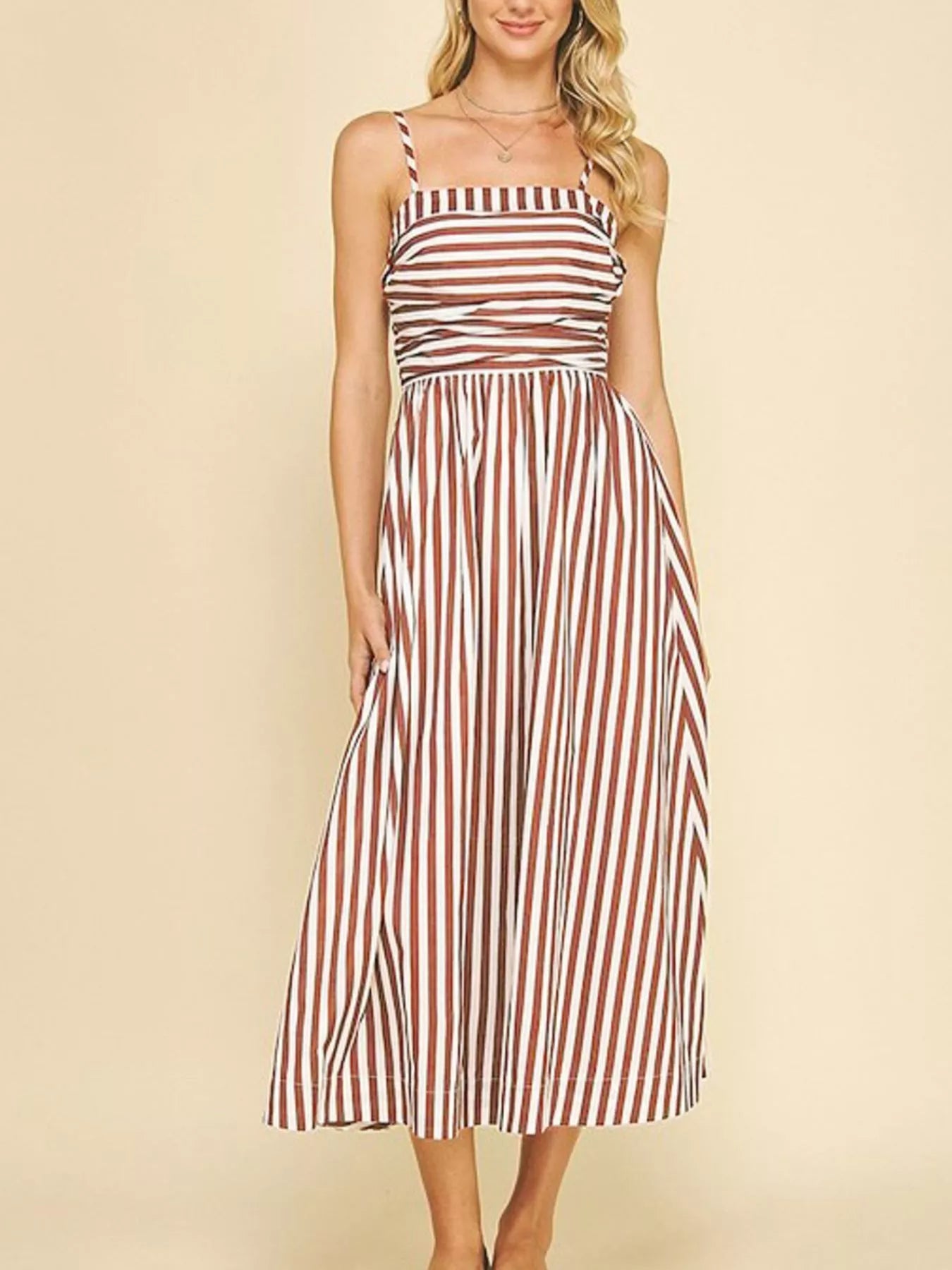 Striped Spaghetti Strap Casual Maxi Dress for Summer Wear in brown and white stripes with a fitted top.