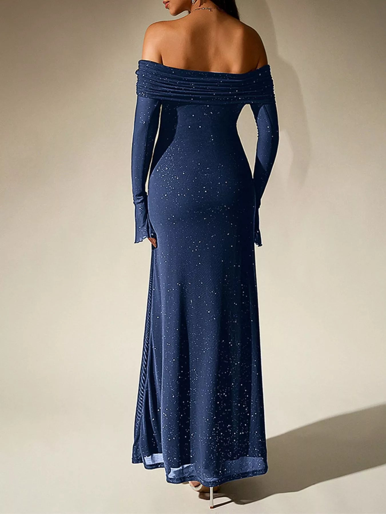 Glitter Off-Shoulder Maxi Dress showcasing a shimmering design from the back, perfect for elegant evening looks.