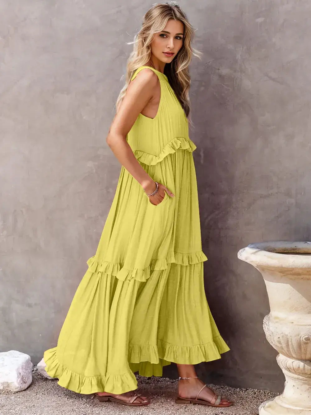 Ruffled Sleeveless Tiered Maxi Dress with Pockets in vibrant yellow, featuring soft ruffles and flowing tiers.