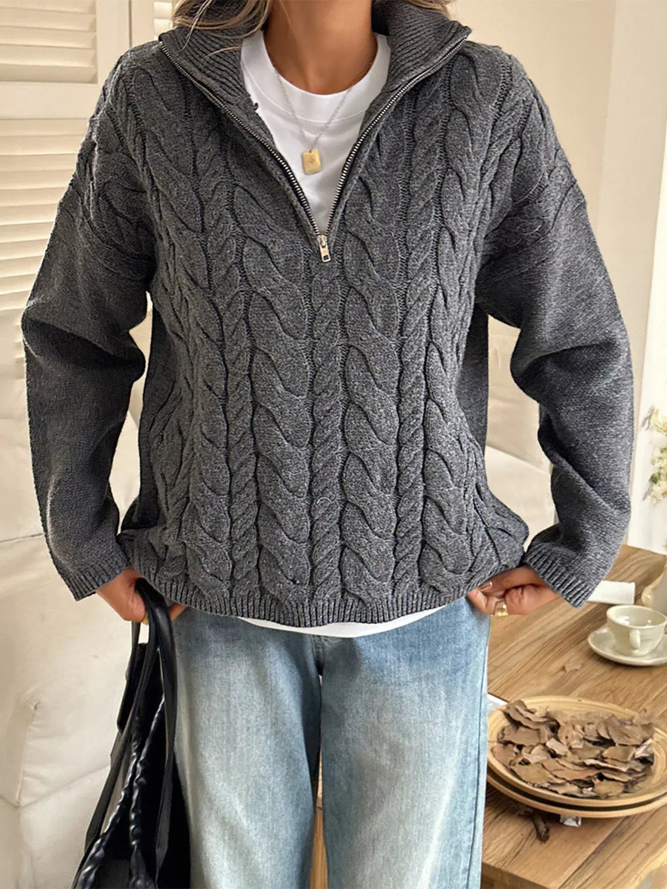 Zip collar cable-knit sweater in gray with a zip-up collar, featuring a cozy cable-knit design.