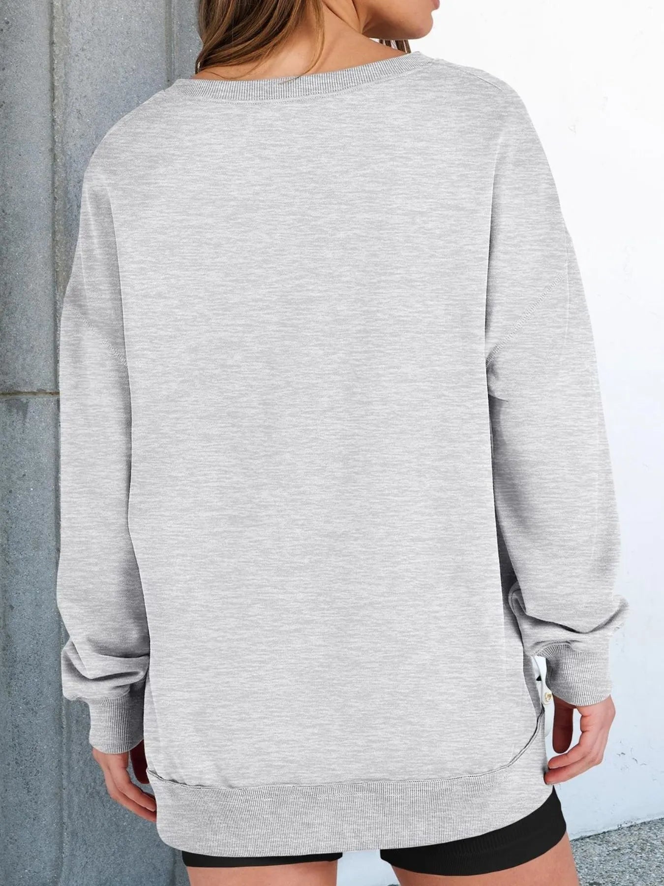 Back view of Notched Long Sleeve Oversized Sweatshirt in grey, showcasing casual style and contrast stitching.