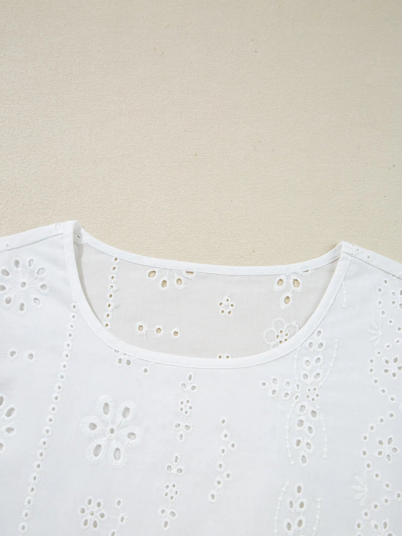 Eyelet Long Sleeve Blouse with Elastic Cuffs featuring a detailed floral eyelet design on a white background.