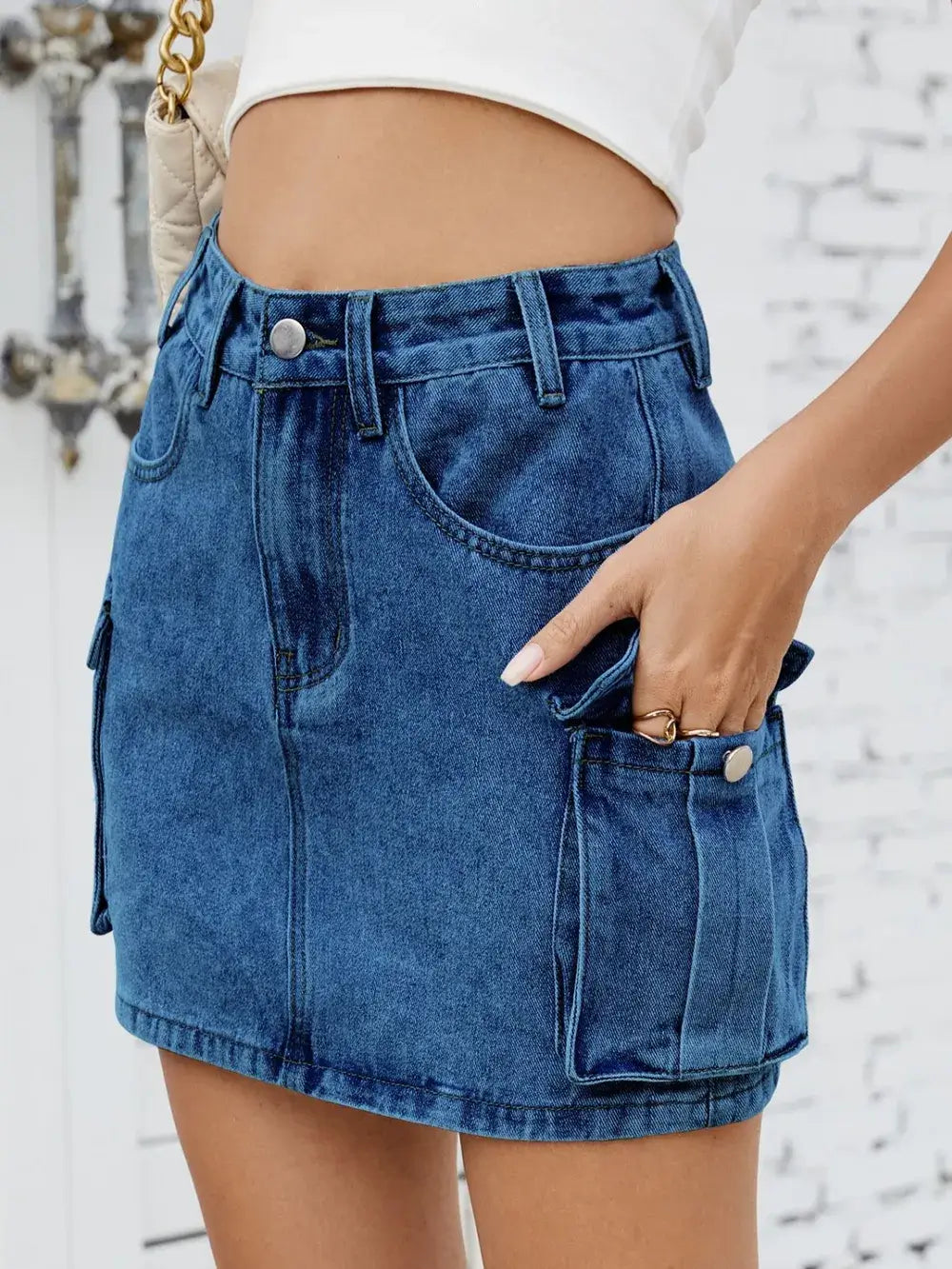 Cargo denim skirt for women featuring functional pockets, stylish design, and comfortable fit.