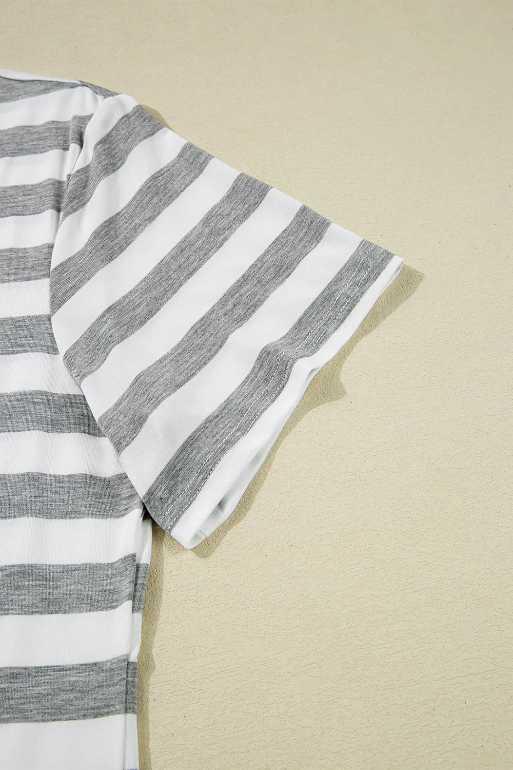 Casual Striped V-Neck Midi T-Shirt Dress showing the striped sleeve detail against a neutral background.