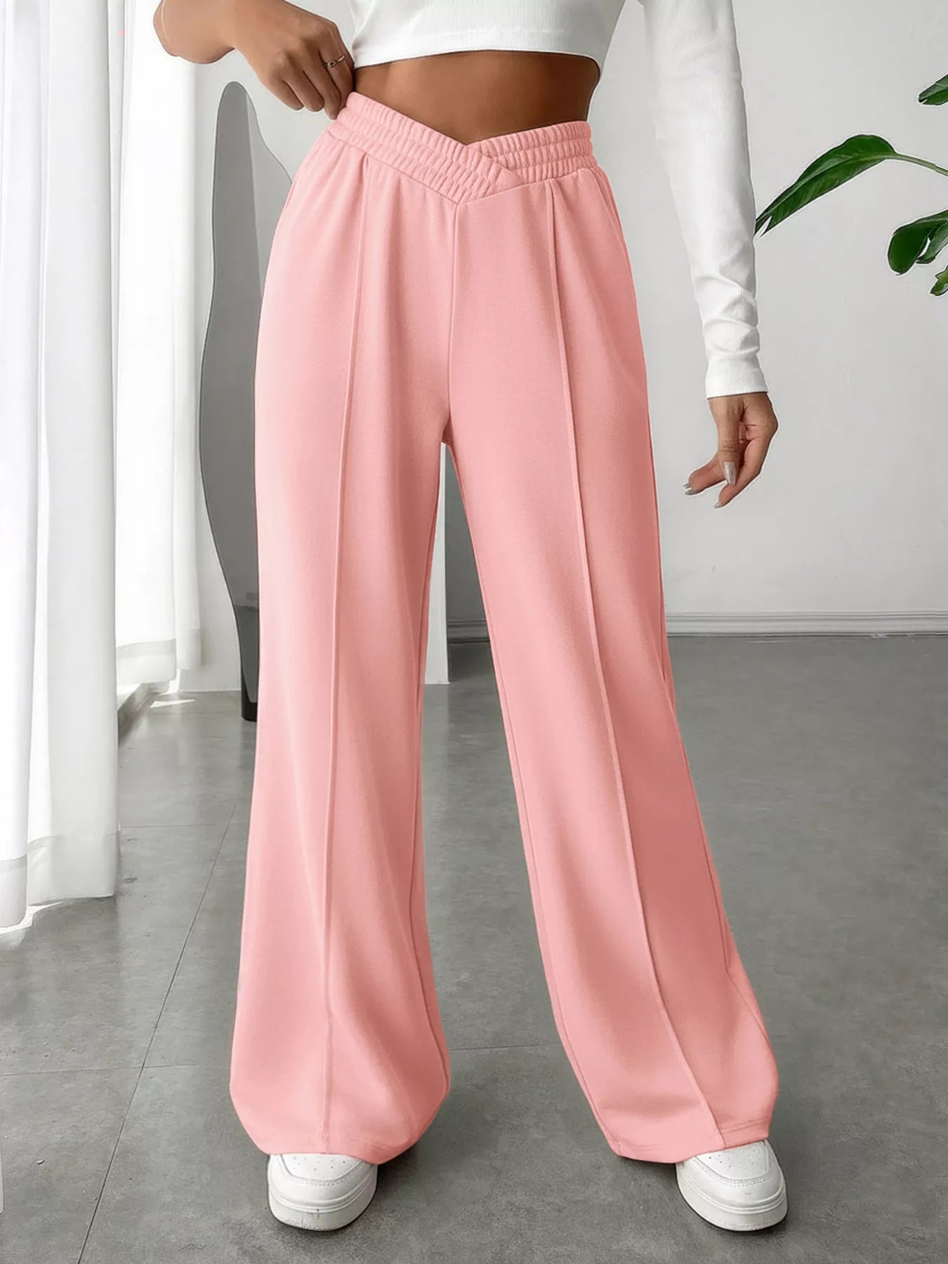 Wide Leg High Waist Pants in pink, featuring a comfortable waistband and elegant style for varied occasions.
