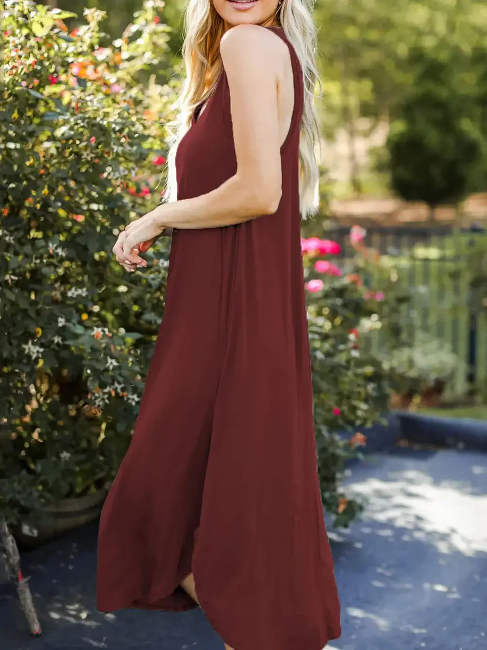 Model wearing Full Size V-Neck Midi Tank Dress in burgundy, showcasing a casual and chic style outdoors.