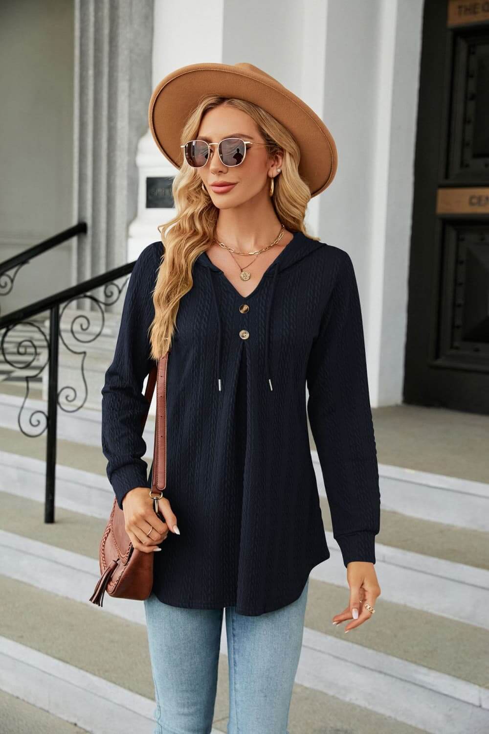 Long Sleeve Hooded Blouse in navy worn with jeans and a hat, showcasing casual style and comfort.