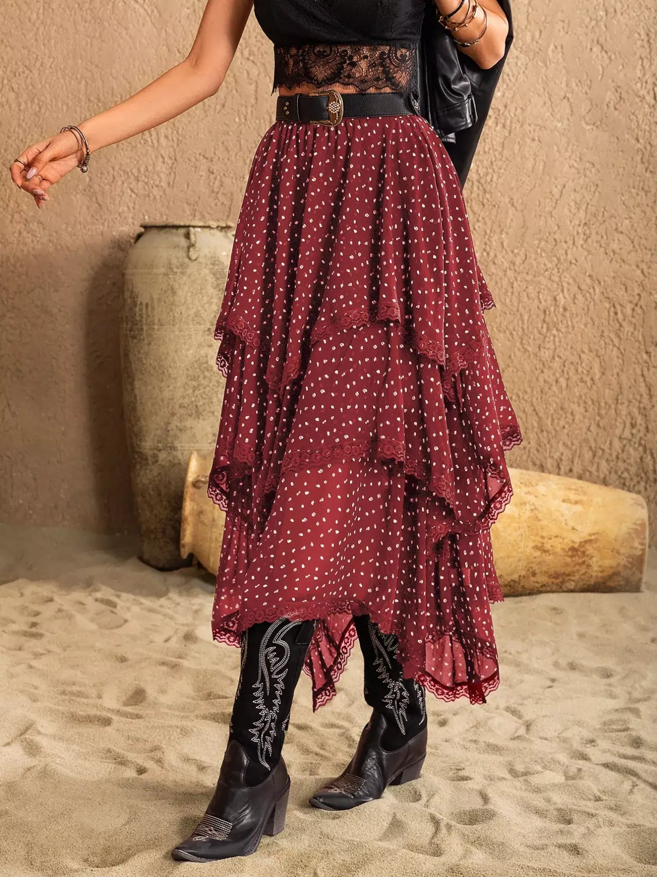 Lace Detail Layered Skirt styled with a black top and boots, showcasing its elegant design and tiered layers.