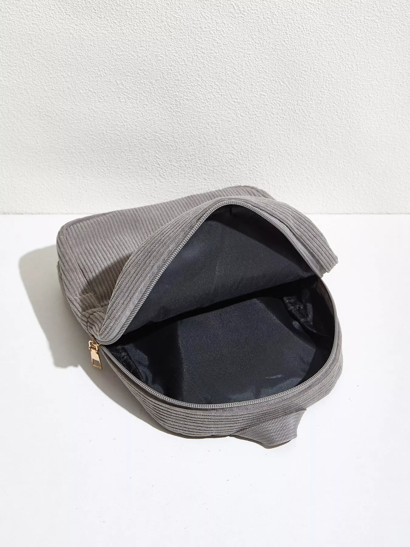 Casual Corduroy Backpack Bag open, showcasing the spacious black interior for daily urban use.