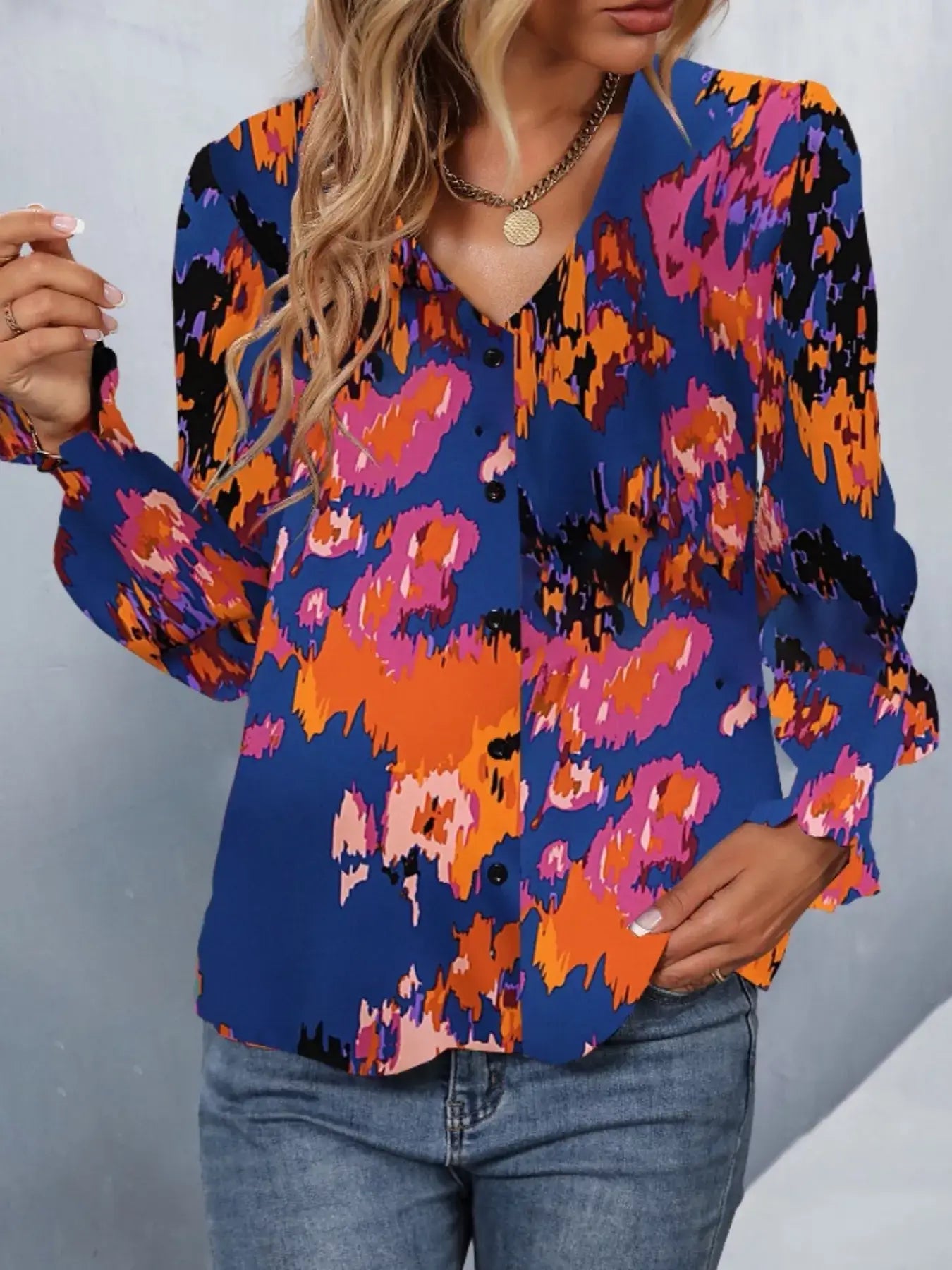 Printed button up long sleeve shirt in vibrant colors, featuring long sleeves and a classic cut for versatile style.