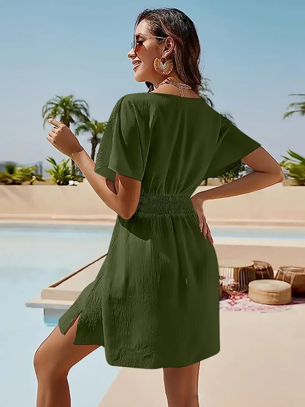 Smocked V-Neck Short Sleeve Dress in green, featuring a slit and smocked waist, perfect for casual summer outings.