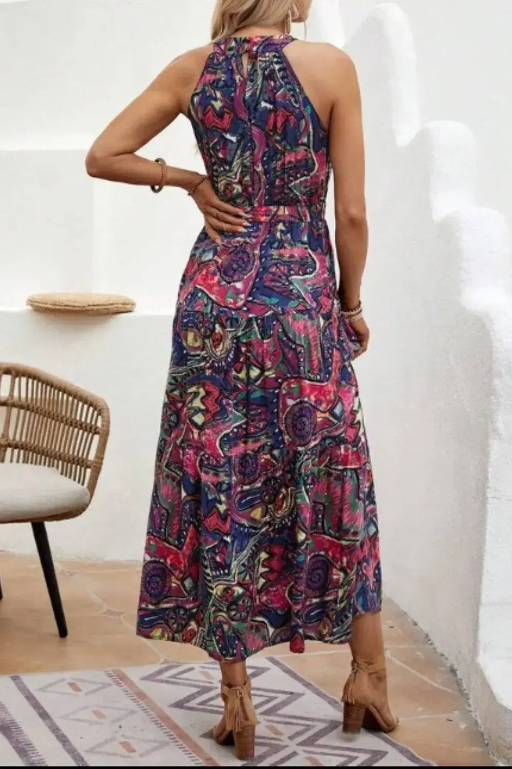 Tied Floral Sleeveless Dress shown from the back, featuring a colorful floral design, perfect for summer outings.