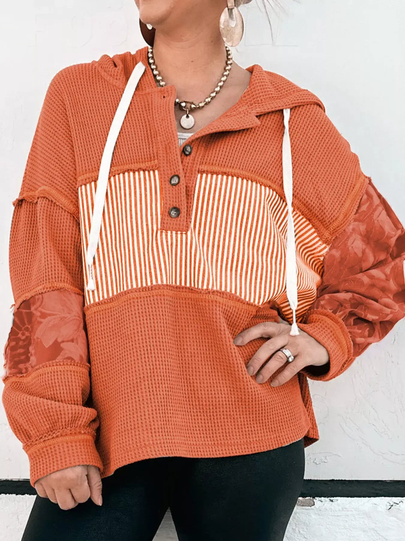 Waffle Knit Color Block Striped Drawstring Hoodie featuring orange color block stripes and textured waffle-knit fabric.