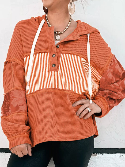 Waffle Knit Color Block Striped Drawstring Hoodie featuring orange color block stripes and textured waffle-knit fabric.