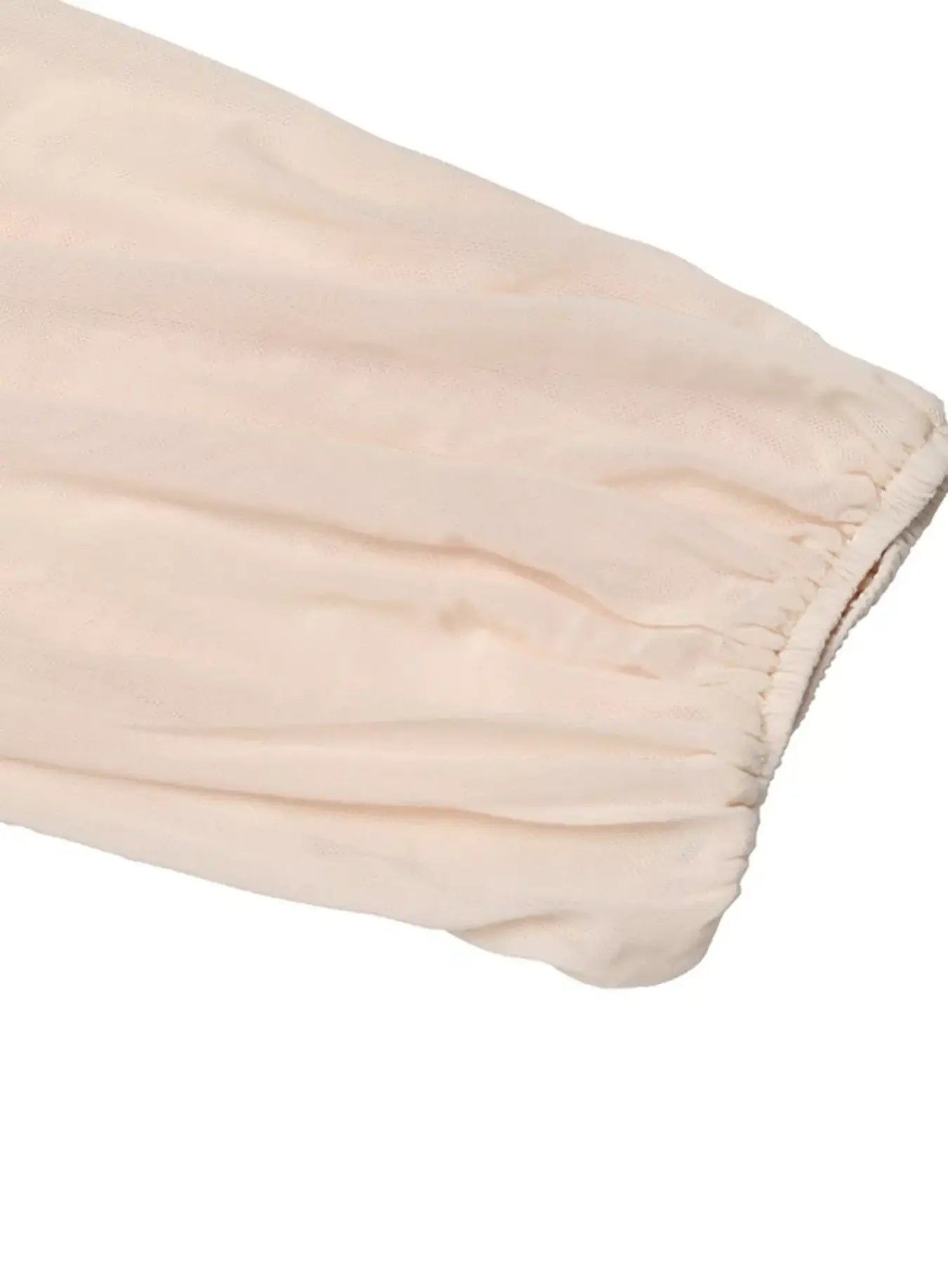 Close-up of the balloon sleeve detail on the sweetheart neck balloon sleeve bodysuit in soft fabric.