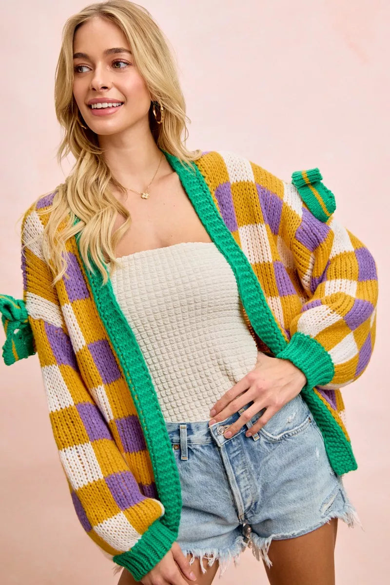 Bibi Mardi Gras Checker Board Front Open Cardigan for Women with vibrant colors, worn casually over a tank and shorts.