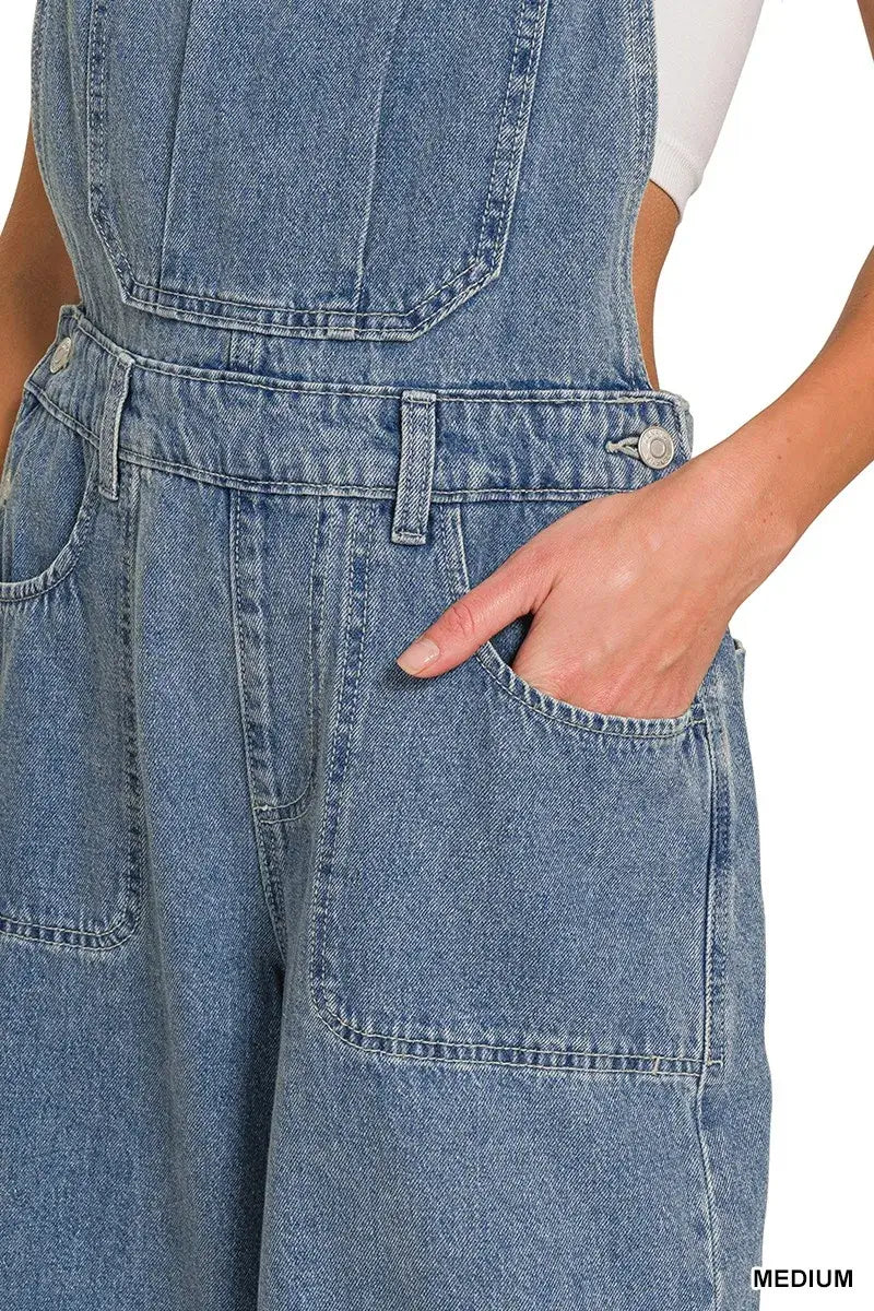 Close-up of Zenana Denim Wide Leg Overalls in medium wash, showcasing pockets and relaxed fit for casual style.