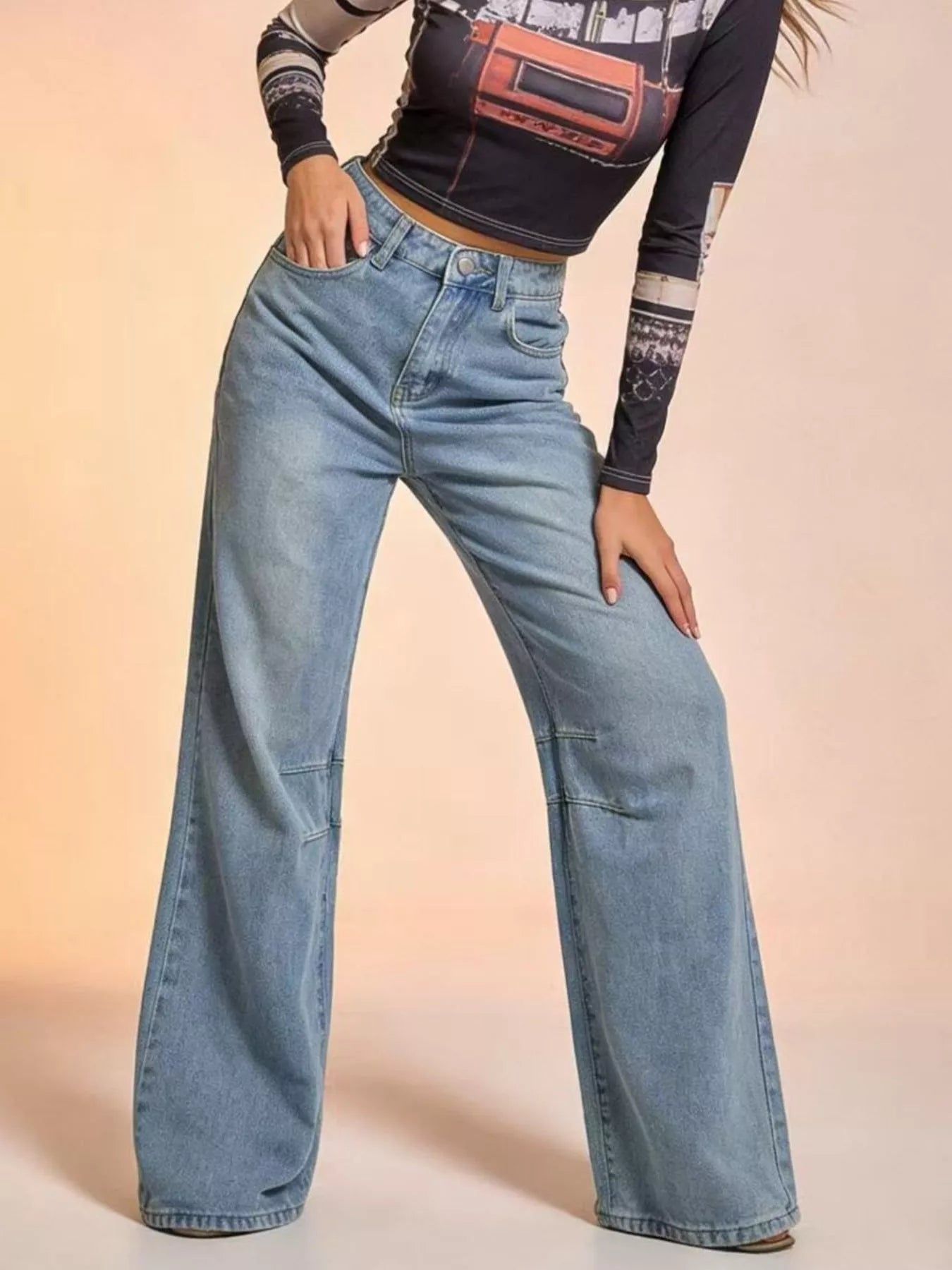 Wide Leg Wash Jeans with Buttoned Pocketed Design worn by model, showcasing a stylish and casual denim look.