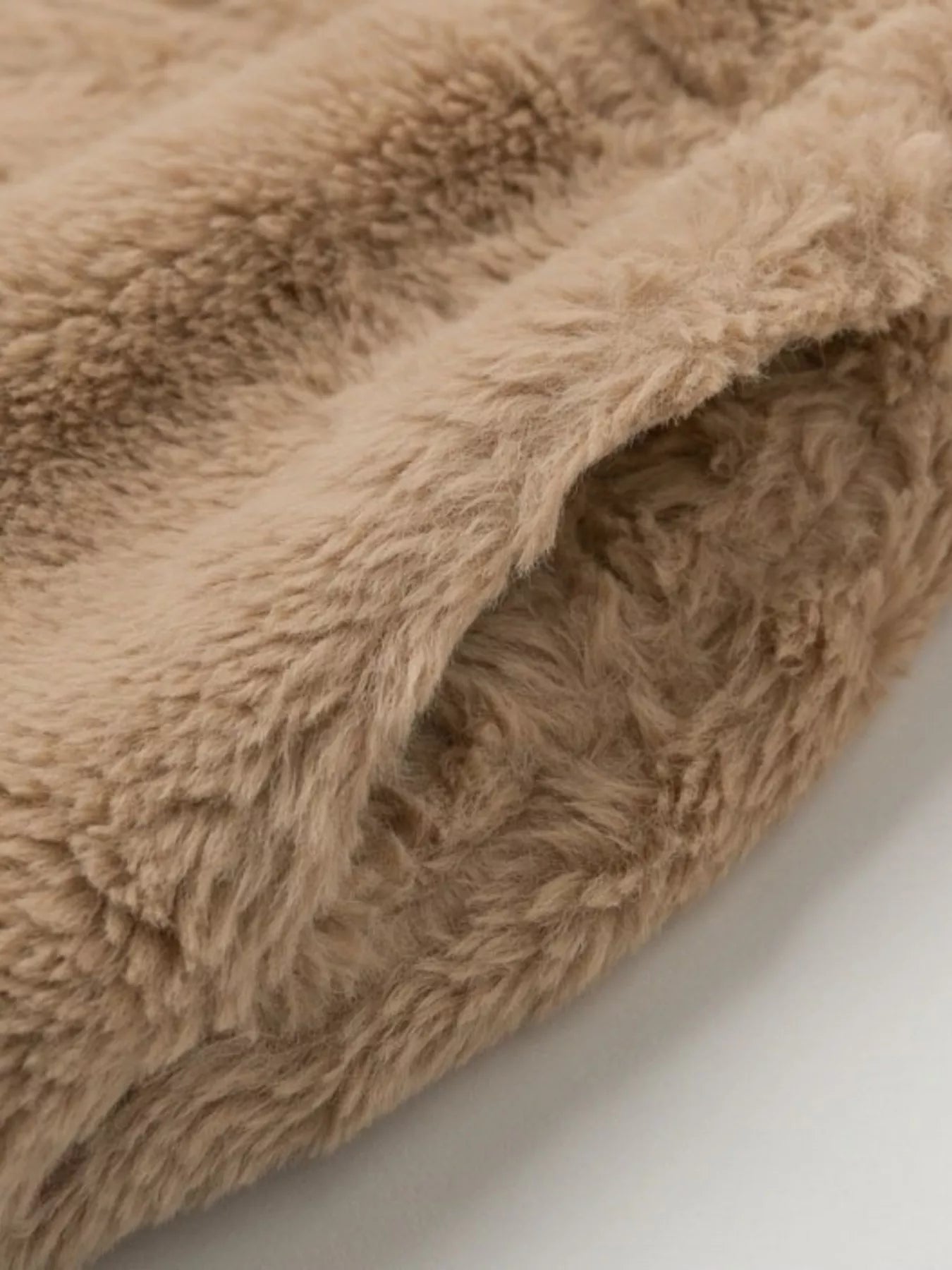 Close-up of faux fur fabric showcasing texture for the Faux Fur Cropped Zip-Up Jacket.