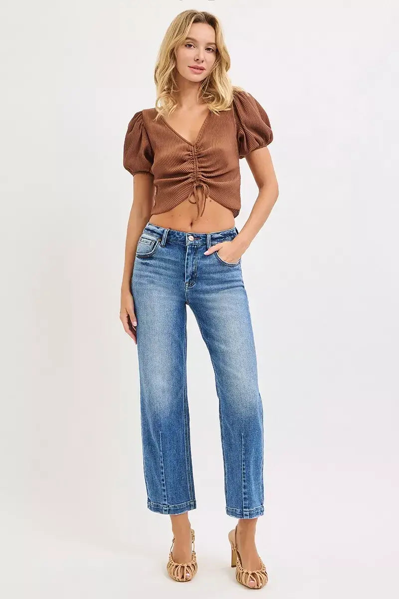 Model wearing RISEN High Rise Crop Boyfriend Tapered Jeans with a stylish top and heels.