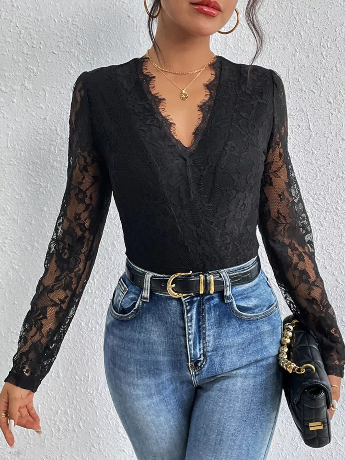 Lace V-Neck Long Sleeve Bodysuit styled with high-waisted jeans and accessories.