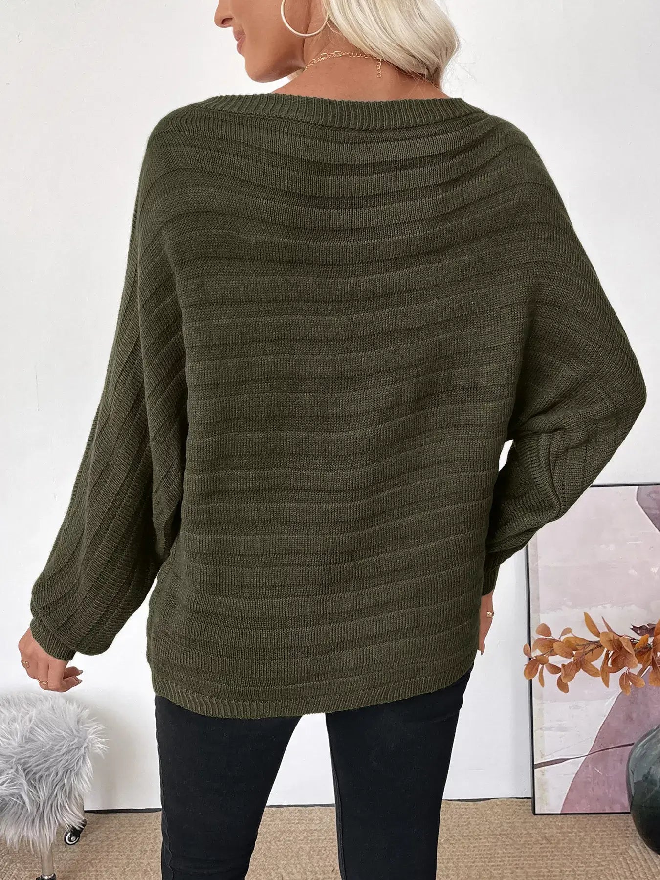 Boat Neck Ribbed Long Sleeve Sweater in olive green worn with black pants, showcasing stylish ribbed texture and relaxed fit.