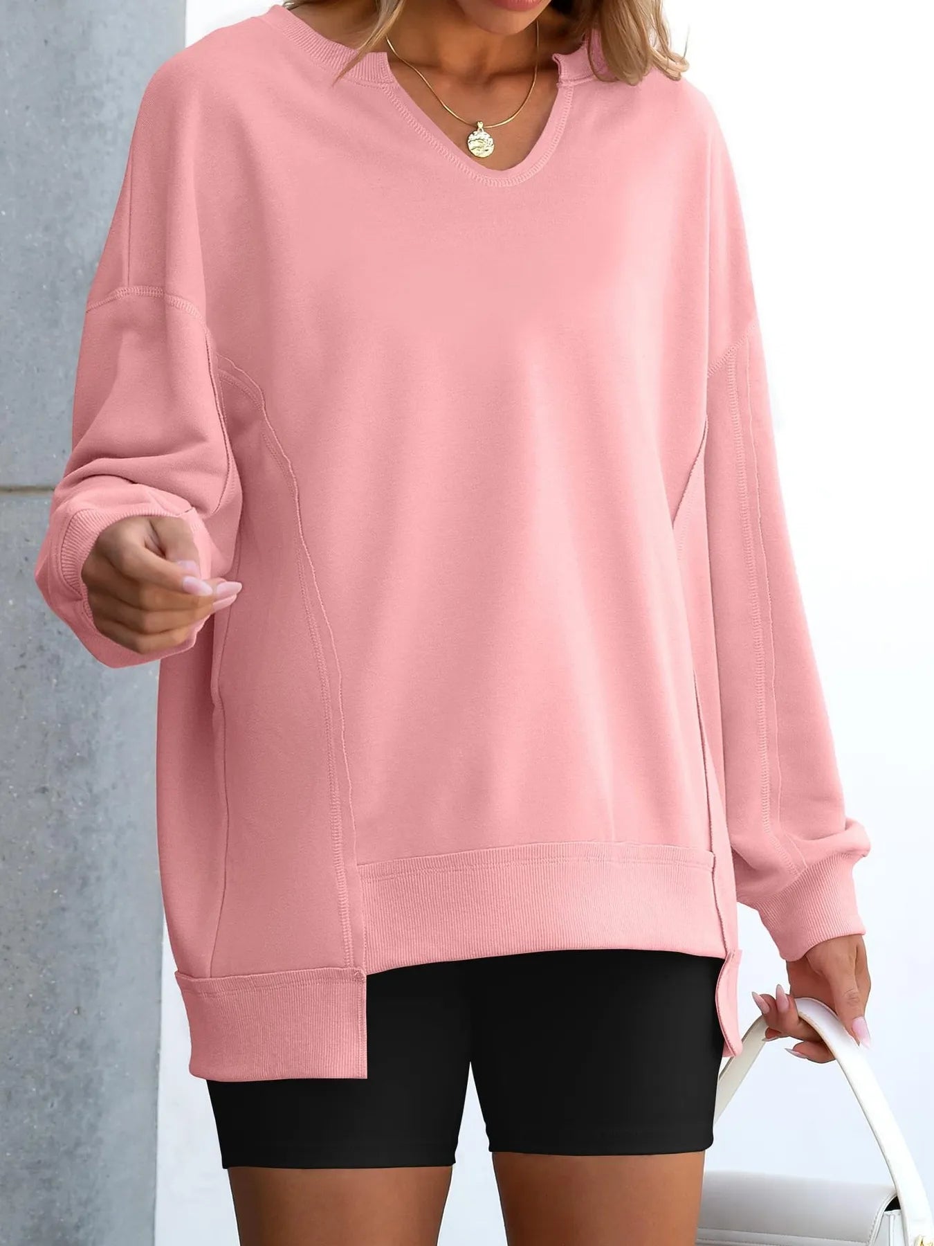 Notched Long Sleeve Oversized Sweatshirt in soft pink, featuring a basic style and contrast stitching.